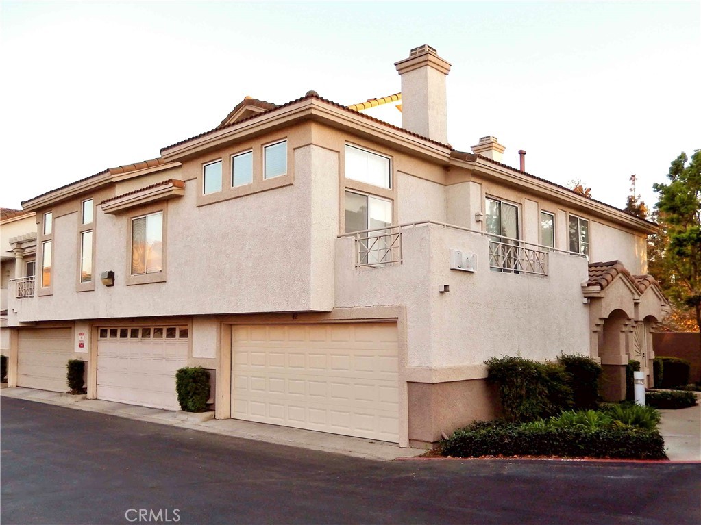 Immaculate 2 Br/2 bath +1 enclosed Loft, 1382 sqft, attached double garage in Ontario. Super clean townhome in one of the nicest complexes and areas in Ontario. It is close to Ontario Mills Mall, Metrolink, Ontario Airport, Toyota Arena, and Victoria Gardens. This unit has cathedral ceilings and an open layout with new central air and heating. It also includes a large enclosed loft with gorgeous wood flooring and an incredible view of the mountains that can be used for 3rd bedroom or office. The master bedroom has its own attached balcony for morning coffee with a mountain view and features an en-suit with his and hers sinks, oversized bathtub, roomy walk-in closet, and newer tile flooring, all enhanced bya skylight ambience and vaulted ceiling. The second bedroom also has a mountain view with a large closet and full bath across the hall. The kitchen includes a dishwasher, gas stove/oven, built-in microwave and roll out cupboards in the pantry. It also overlooks the spacious dining room and living room, including a feature wall accenting the living room with a tiled gas fireplace, elevated privacy windows and a large second balcony. The attached double garage has washer and gas/ electric dryer hookups and a newer water heater. There are 2 beautiful large pools and in ground spas only a short distance from the front door. It is a desirable end unit in a very quiet area.
