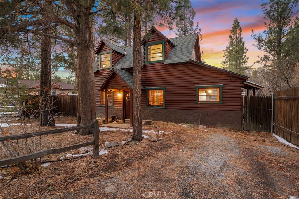 Tucked among the pines just minutes from the lake, ski slopes, and village, this cozy 3-bedroom, 1-bath vintage cabin offers the perfect blend of charm, privacy, and convenience. With its warm wood interiors and a stunning original fireplace as the heart of the home, every corner invites relaxation. Step out onto the private deck and soak in the hot tub beneath the stars, or enjoy quiet mornings surrounded by nature. Thoughtfully maintained and lovingly updated to preserve its mid-century character, this cabin has been a cherished getaway for families and adventurers alike. A high-performing short-term rental with over 350 glowing reviews, it's not just a retreat—it's an investment opportunity. Whether you're seeking a peaceful escape or a turnkey income property, this mountain haven delivers the best of both worlds. Don’t miss your chance to own a piece of classic mountain living.