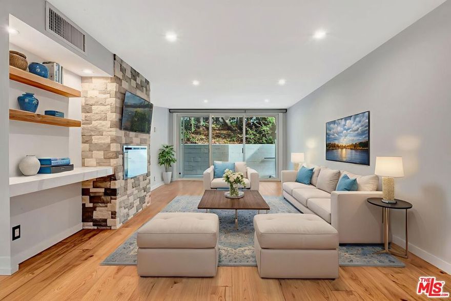 Located in the heart of West Hollywood, this thoughtfully updated 1-bedroom, 1-bath residence offers comfort, style, and convenience in one of the city's most sought-after neighborhoods. The open living and dining area features a new electric fireplace, built-in shelving, and a wet bar, creating an inviting setting for both relaxing and entertaining. The kitchen is designed with all new countertops and cabinetry, stainless-steel appliances, and a wine fridge, blending functionality with modern appeal. A covered patio extends the living space outdoors, while the bedroom includes a walk-in closet and an adjacent updated bath. Additional highlights include an in-unit washer and dryer (a rare feature in this building), newly installed HVAC system, and an upgraded electrical panel. This quiet first-floor corner unit shares only one wall and includes one assigned parking space plus guest parking. West Knoll Condominiums provides a range of amenities including a pool, spa/sauna, sundeck, controlled access, and gated subterranean parking with an additional parking lot for guests. Situated just north of Santa Monica Boulevard and west of La Cienega, this home places you close to everyday conveniences and vibrant local destinations. Enjoy easy access to Trader Joe's and the upcoming Erewhon, the newly reimagined West Hollywood Park & Dog Park with its Aquatic & Recreation Center offering fitness and open green space, and the storied Sunset Strip, known for its restaurants, music venues, and iconic nightlife.