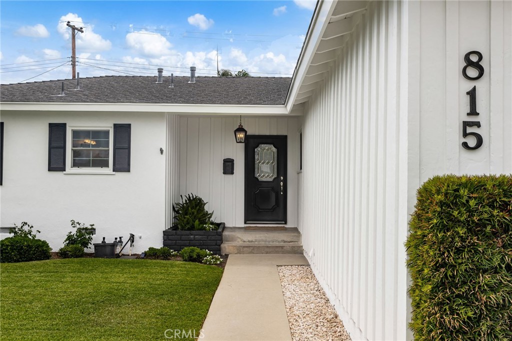 You won't want to miss this delightful cottage with so many lovely improvements you're sure to fall in love!
This impeccable single-story home offers timeless charm and modern upgrades throughout. Step inside to beautiful recently refinished wood flooring and a spacious living room featuring a romantic fireplace with a custom mantle and two sets of double French doors which offer an abundance of soft natural light and open to the peaceful backyard setting. This beautiful room is made only lovelier with its smooth ceilings and new recessed lighting illuminating the area from above. The spacious and functional kitchen boasts quality appliances, including a 5 burner freestanding range, microwave, dishwasher and refrigerator. Granite countertops blanket the cabinetry, and a stainless steel sink coupled with the thoughtful layout make this kitchen perfect for everyday living as well as entertaining. The dining room is nestled between the kitchen and living room and features a bank of delightful windows with a trellis and meandering vine as a backdrop. Steps down the hall are the three immaculate bedrooms and two wonderfully appointed bathrooms. The Hall bath offers ample cabinet and counter space, a darling laundry basket or storage area, and a large bathtub with handsome tile surround with mosaic accent tile and an extra wide shampoo niche. The primary bedroom has a private bathroom with brand new cabinetry, lighting and hardware plus a large shower with a sleek frameless shower door, new hardware and tile surround with mosaic accent tile. New carpet and and stylish lighting can be enjoyed in all three bedrooms.
Crisp new interior paint, updated interior doors and hardware, and meticulous attention to detail make this home truly move-in ready. Enjoy California living year-round with a gorgeous and durable vinyl covered patio complete with recessed lighting and a soothing ceiling fan, professional hardscape, beautiful vinyl fencing across the back and the north side of the yard, plus pristine lawns and abundant gardens in the backyard. The entire exterior has also been painted in crisp white with dramatic black trim. The front yard also offers an impeccable lawn and gorgeous landscape making for an always inviting welcome home.
Located just minutes from downtown Brea, Brea Mall, the Brea Plunge, local parks and top-rated schools. This beautiful home is a rare find. You won't want to miss your opportunity to make this one your very own!