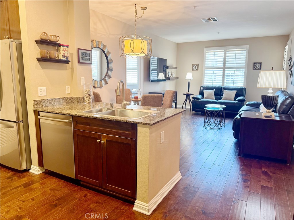 Welcome to this beautifully upgraded 2-bedroom, 2-bathroom condo located in the exclusive gated community of Avenue One, perfectly situated on the border of Irvine and Newport Beach. This second-floor unit offers both luxury and convenience, directly across from the clubhouse and just steps away from two side-by-side assigned parking spaces—an exceptional benefit in this sought-after community.
Enjoy a bright, open floor plan with hardwood flooring in the living room, brand-new high-end carpet in both bedrooms, fresh designer paint, chandelier lightings and premium plantation shutters throughout. The spacious primary suite features dual closets, including a generous walk-in closet, and a private full bathroom with granite countertops. Additional highlights include a sealed and waterproof private patio, in-unit laundry & premium quality chandeliers. Residents of Avenue One enjoy resort-style living with a sparkling pool and spa, a fully equipped fitness center, indoor basketball court, BBQ and picnic areas, and an upscale clubhouse with shuffleboard, a TV lounge, and kitchenette. The community also offers an on-site marketplace with trendy cafés and restaurants. Ideally located just steps from the UCI shuttle stop and minutes from John Wayne Airport, Newport Beach, Corona Del Mar, The District, and with convenient access to the 405, 55, 73, and 5 freeways, this home is perfect for first-time buyers, investors, or those looking to downsize without compromising on style, location, or lifestyle.