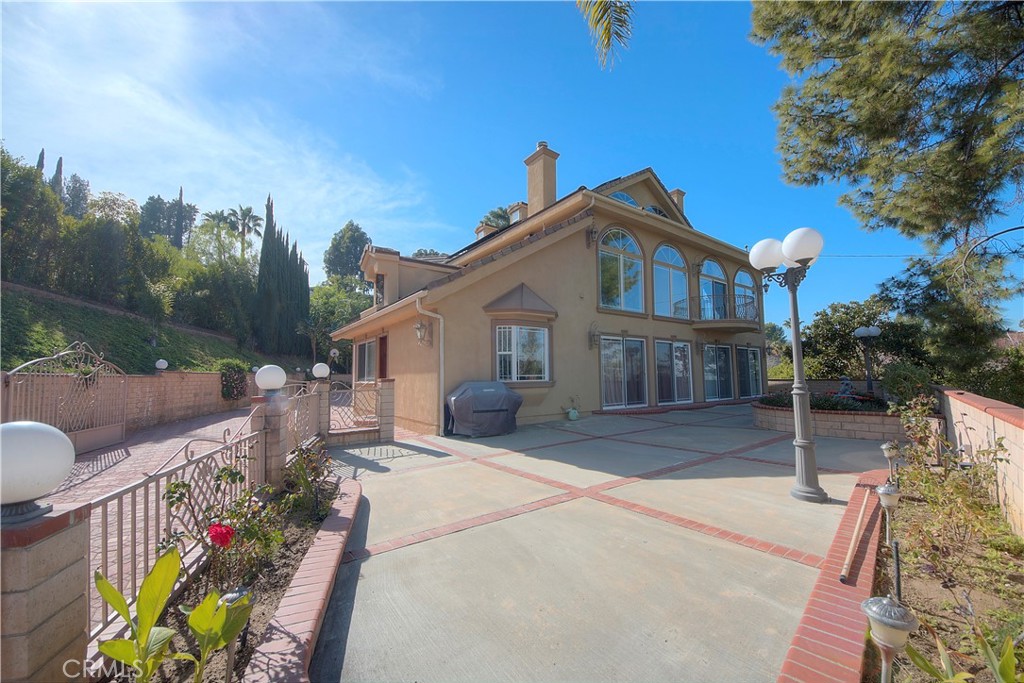 Discover a rare opportunity to own this stunning 5-bedroom, 6-bathroom gated estate nestled in one of Encino’s most private and sought-after enclaves. Situated on an expansive 19,000+ sq ft lot, this exquisitely designed home offers more than 4,000 sq ft of elegant living space, combining comfort, sophistication, and exceptional value. Step inside to soaring high ceilings, rich crown molding, and recessed lighting that create a sense of grandeur throughout. The heart of the home is the oversized gourmet kitchen featuring a large center island—ideal for both entertaining and everyday living. The spacious living room with a cozy fireplace flows seamlessly into a massive family room, perfect for gatherings of any size.
Ideal for multi-generational living or hosting guests, this home offers two generously sized ensuite bedrooms downstairs. Upstairs, you'll find two additional bedrooms plus a luxurious primary suite complete with a huge walk-in closet and spa-like bathroom, featuring a soaking tub and dual vanities. Step outside to your private backyard oasis with a sparkling pool, spa, built-in BBQ area, and room to entertain under the stars—all surrounded by serene views of the city skyline. The property also includes solar panels to reduce your energy costs. Through the secure gated entry, you'll find an attached 2-car garage and ample space to park up to 10 additional vehicles—an entertainer’s dream.This turnkey residence is ready for you to move in and enjoy from day one. Words can't capture the full experience—this is truly a must-see property.
