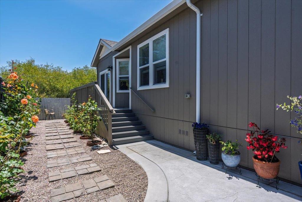 Affordable coastal living in a immaculate custom built 2022 home located in one of Santa Cruz County's most desirable 55+ communities where pets are welcome! This 3-bedroom, two bath manufactured home offers a modern kitchen with quality finishes, a walk-in closet, a dedicated laundry room, and a open layout designed for comfort and convenience. A beautiful bay window in the living room looks out over a rose-filled garden and peaceful green spaces, offering natural light and serene views. Enjoy the mild coastal climate, low space rent, and community amenities in a quiet, friendly, setting. Conveniently located near highway one, shopping, dining, and the new Aptos Library. This is a rare opportunity to own a newer home near the coast at an affordable price. Perfect for retirement!