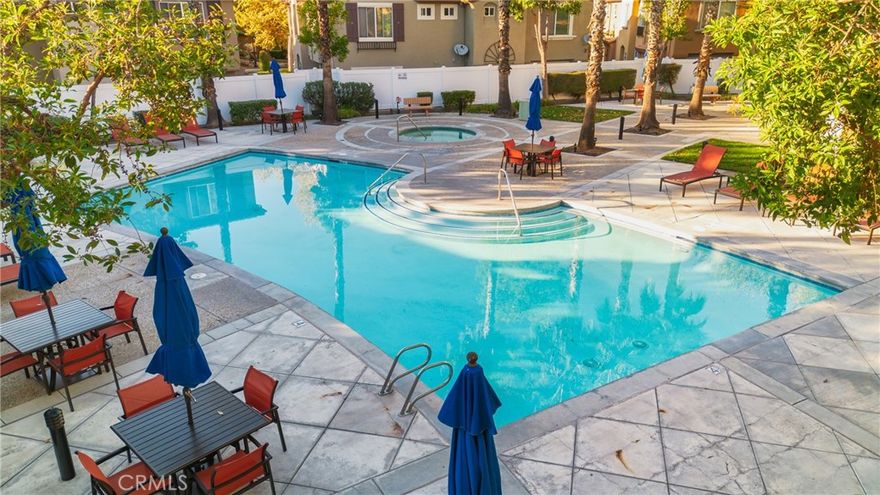 Welcome to 27946 John F. Kennedy #A in Moreno Valley—a beautifully maintained 2-bedroom, 2-bath condo located in the highly desirable Rancho Belago community within the Promontory Association. This 1,110 sq. ft. home offers an open-concept layout with high ceilings, large windows, and abundant natural light. The kitchen features generous cabinetry, ample counter space, and a spacious island perfect for cooking, entertaining, and gathering with loved ones. The living room includes a cozy fireplace and media nook, providing a warm and inviting feel. The primary bedroom boasts a walk-in closet and private ensuite bathroom, while an indoor laundry room adds everyday convenience. Enjoy relaxing mornings or evenings on your private balcony, and benefit from direct access to an attached one-car garage plus an additional reserved parking space. The community offers resort-style amenities including a pool, spa, and restrooms, all maintained by the HOA—making this a low-maintenance lifestyle option. Ideally located near schools, shopping, popular parks, Lake Perris, Rancho Del Sol Golf Course, and Celebration Park, this home combines comfort, convenience, and a welcoming neighborhood setting.