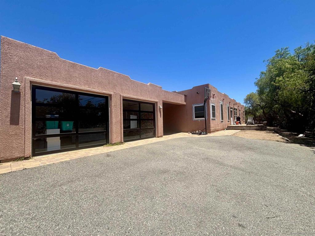 Handyman Special! Opportunity Awaits, Partially Renovated Santa Fe Style Home On 2.5 Acres, New: Roof, A/C, Flooring, Glass Garage Doors, Primary Bathroom w/ Steam Shower & Soaker Tub, Windows (some still need installation but material is there), Wainscoting In Living Area, Tankless Hot Water Heater. 9' Flat Ceilings. Needs Finishing Touches, Exterior Paint & Stucco Repair, Int. Paint, Yard Clean Up, Etc. The Kitchen And Other Bathrooms Are Original. Homes In The Area Updated Are Around $1.2M Escape The Chaos Of The City And Relax In Safety At This Gated & Fully Fenced 4 Bed 3.5 Bath Santa Fe Style Home w/ Solar On 2.5 Acres In The Highly Sought After Community Of Bonsall. Where The " Bonsall Breeze" Flows Daily And Room To Spread Out. This Property Is Zoned A-70 With "W" Animal Designation Providing Opportunity For Horse Training, Breeding or Boarding Without The Time & Cost Of Obtaining A Use Permit, Or Enjoy Your Own Family Animals, Plant A Vineyard Or Other Crop. Room For RV And Toys