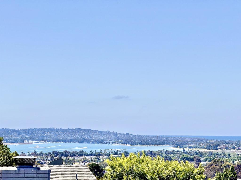 Discover this beautifully renovated modern retreat in the highly desirable Bay Ho neighborhood, now offered at an exceptional value. Enjoy truly breathtaking panoramic views of Mission Bay, the ocean, and vibrant evening sunsets from your own private sanctuary. Recently updated with over $160,000 in high-end improvements, this 4-bedroom, 2.5-bath home offers 1,876 sq. ft. of thoughtfully designed living space that blends luxury, comfort, and style. The open-concept floor plan welcomes you with brand-new wide-plank vinyl flooring, recessed lighting, and floor-to-ceiling windows that flood the interior with natural light. The chef’s kitchen is an entertainer’s dream, featuring dual quartz island countertops, sleek custom cabinetry, and premium stainless steel appliances. Retreat to the spacious primary suite with a spa-inspired bath and enjoy seamless indoor-outdoor living with multiple view decks and private lounging areas. Whether you're hosting guests or relaxing in the serenity of your home, every detail has been curated for modern coastal living. Conveniently located near beaches, shopping, dining, and major freeways. This is a rare opportunity to own a turnkey view property in one of San Diego’s most sought-after communities! Discover this beautifully renovated modern retreat in the highly desirable Bay Ho neighborhood, now offered at an exceptional value. Enjoy truly breathtaking panoramic views of Mission Bay, the ocean, and vibrant evening sunsets from your own private sanctuary. Recently updated with over $160,000 in high-end improvements, this 4-bedroom, 2.5-bath home offers 1,876 sq. ft. of thoughtfully designed living space that blends luxury, comfort, and style. The open-concept floor plan welcomes you with brand-new wide-plank vinyl flooring, recessed lighting, and floor-to-ceiling windows that flood the interior with natural light. The chef’s kitchen is an entertainer’s dream, featuring dual quartz island countertops, sleek custom cabinetry, and premium stainless steel appliances. Retreat to the spacious primary suite with a spa-inspired bath and enjoy seamless indoor-outdoor living with multiple view decks and private lounging areas. Whether you're hosting guests or relaxing in the serenity of your home, every detail has been curated for modern coastal living. Conveniently located near beaches, shopping, dining, and major freeways. This is a rare opportunity to own a turnkey view property in one of San Diego’s most sought-after communities!