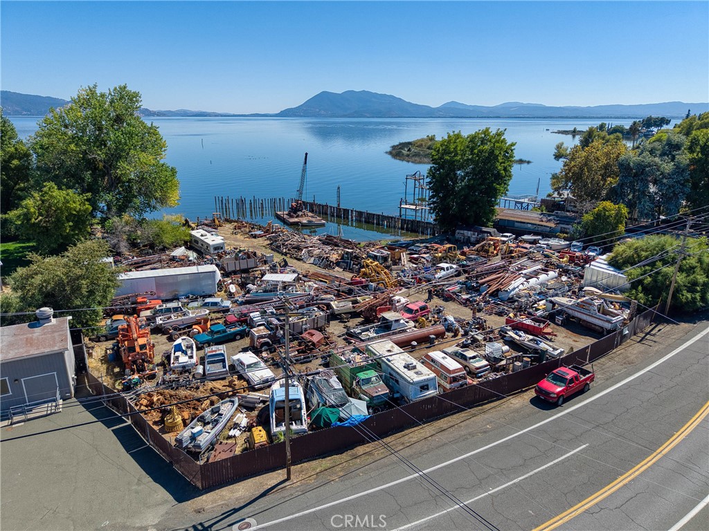 Clear Lake Beachfront Property offers an exceptional investment opportunity comprising three contiguous parcels on the shores of Clear Lake. Encompassing 2.96 acres with approximately 355 feet of frontage, the property includes one CR-zoned lot and two R1-zoned lots, each positioned to capture unobstructed views of Clear Lake and Mount Konocti. The unique combination of commercial and residential zoning provides significant development flexibility—ideal for hospitality, mixed-use, residential, or a combination of income-generating ventures. Its proximity to public transportation enhances accessibility while preserving the appeal of a waterfront location. This is a rare chance to acquire a sizable stretch of Clear Lake frontage with strong long-term potential for both development and appreciation.
