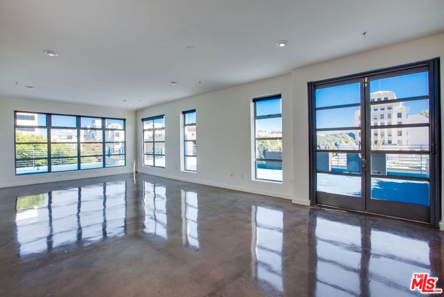 Experience unparalleled privacy and luxury in the heart of Santa Monica, just a stone's throw away from the vibrant 3rd Street Promenade, the cliff-top Santa Monica Palisades Park and stunning beach. The contemporary penthouse, perched above the renowned Burke Williams Spa, offers a sprawling 2900 sq ft interior with 4 bedrooms and 3.5 bathrooms plus huge wrap-around private patio. The modern architectural design showcases a seamless blend of cement and hardwood floors, steel, and glass, creating a sophisticated ambiance. Enjoy the newly renovated state-of-the-art kitchen with sleek white quartz countertops, while the expansive wrap-around patio off the living room is an ideal space for entertaining and al fresco dining. Two ensuite bedrooms on the second level each boast high beamed ceilings, walk-in closets and private balconies with city views. On the first level, you'll find two additional bedrooms, including one with its own private entry door, along with a full bathroom, a powder room, and a laundry room. A private entry courtyard and an exclusive tenant-only elevator from the parking garage provide the utmost convenience and security. As a unique perk, tenants receive a special "tenant membership" to the prestigious Burke Williams SPA, adding a touch of luxury to everyday living. This property is ideally suited for discerning individuals seeking the pinnacle of privacy, convenience, and modern living in Santa Monica.