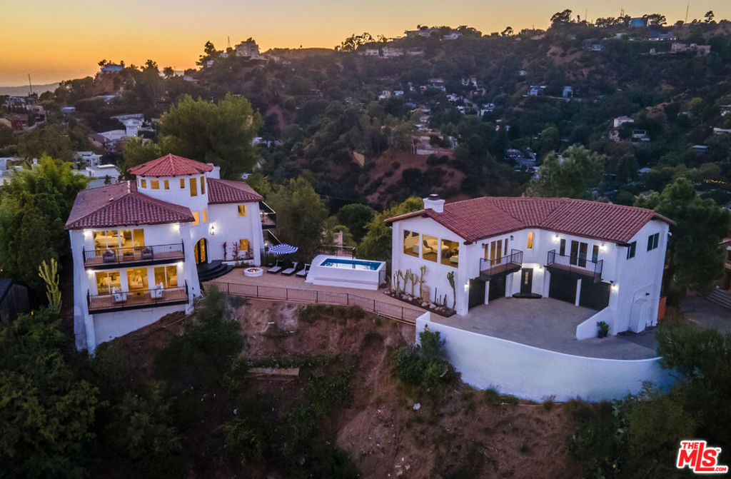 Motivated Sellers! Bring all offers! Can be fully furnished upon request! Welcome to 8300 Grand View Dr, a private oasis perched on a coveted promontory in Laurel Canyon. This fully remodeled Mediterranean-style estate offers 360 views of Los Angeles, showcasing iconic landmarks from the Hollywood Sign and Griffith Observatory to Downtown LA. Designed for the discerning buyer seeking unique luxury, the property features a beautifully crafted main house and a stylish guest house, with every room and window offering complete privacy and exceptional views. Surrounded by lush landscaping and accessed through a secure, gated entry, this estate guarantees seclusion and exclusivity. The expansive outdoor spaces, including a stunning pool and multiple lounging areas, are perfect for relaxation and entertaining. With parking for up to 10 cars, this is an exceptional opportunity to own a rare, highly coveted property that blends tranquility and modern sophistication, just minutes away from the best of Los Angeles.