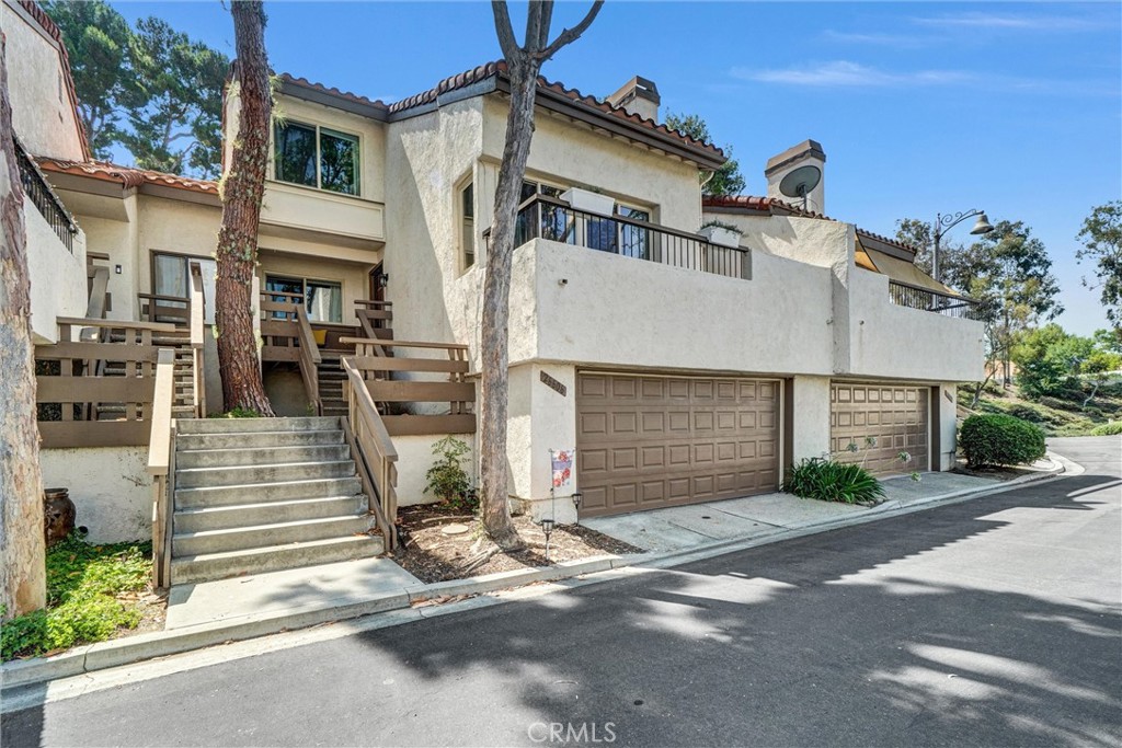 Welcome to 22606 La Roda, a beautifully upgraded and fully furnished 3-bedroom, 3 bathroom home in the heart of Mission Viejo! Thoughtfully renovated and move-in ready, this turnkey residence features fresh interior paint, remodeled bathrooms with modern finishes, new double-pane windows, and brand new PEX plumbing throughout for long term peace of mind. The bright, open-concept living areas are perfect for relaxing or entertaining, and the stylish furnishings are all included-offering a rare opportunity to move in with ease. The well-appointed kitchen flows effortlessly into the dining room where you will find a coffee bar perfect for those morning strolls just outside your patio doors. The family room is so inviting with its vaulted ceilings, cozy fireplace and views of the mountains just off the private balcony. Additional highlights include a spacious 2-car attached garage, an assigned outdoor parking space, and access to 2 sparkling community pools. Located within 2 miles of a golf course, top-rated schools, parks, shops, and dining — and with full Lake Mission Viejo privileges — this home offers the perfect blend of comfort, style, and convenience.
