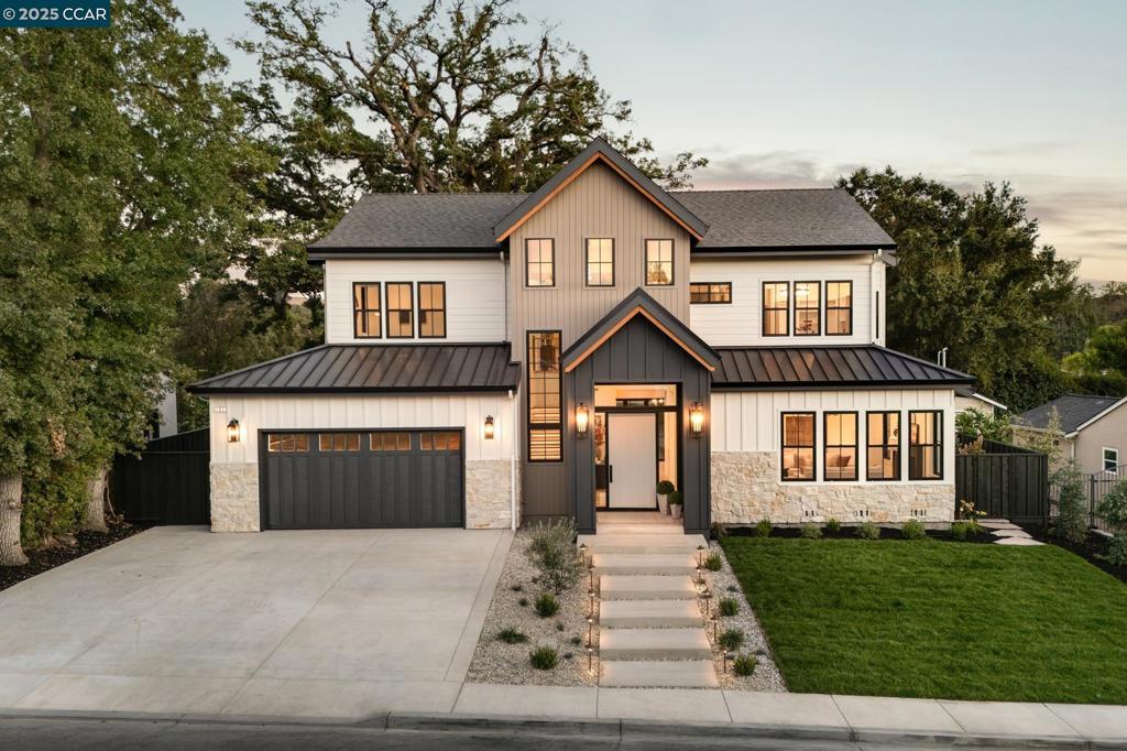 Approaching this brand-new custom home in sought-after Danville—backing onto Diablo Country Club Golf Course—you’ll find timeless design, premium finishes, and exceptional craftsmanship. Designed by John Newton, built by CS Development under Cristian Szilagy, and styled by Roxana Szilagy, no detail is overlooked. Inside, 22 ft. high foyer ceiling, white oak floors, stone countertops, and smooth-finish walls set a refined tone. Custom lighting and Andersen windows elevate every space, while owned solar adds efficiency. A striking foyer accent wall introduces formal living spaces. The chef’s kitchen shines with Taj Mahal quartzite counters, handmade Zellige backsplash, white oak cabinetry, walk-in pantry, Wolf cooktop, Thermador appliances, and an oversized island flowing to the family and dining rooms. Accordion doors open to a covered patio, perfect for entertaining. Two main-level suites offer ideal flexibility. Upstairs, the vaulted primary suite boasts a fireplace, balcony, spa bath with Calacatta Gold marble, dual closets, and laundry access. A loft and two bedrooms complete the level. Outdoors, enjoy a covered patio with skylights, firepit, lawn, and majestic oak. Within San Ramon Valley School District and near Blackhawk & Diablo Country Clubs, this is a rare opportunity.