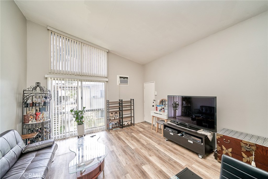 Step into your own private sanctuary in this quiet and private top-floor end unit, tucked away in one of the most desirable corners of the gated Mariner’s Park Village community. With no neighbors above or below, this 1-bedroom, 1-bath condo offers the rare combination of serenity, security, and style. You’re welcomed by a sense of openness by a high vaulted ceiling. The spacious living area leads to a charming private balcony, perfect for morning coffee, reading, or simply relaxing in your own outdoor escape. The balcony is also accessible from the bedroom, making it an extension of your personal haven. The kitchen is well-sized and functional. Additional features include gated community, laundry room right downstairs, location is shielded from freeway noise, ocean breeze, assigned carport parking space with outdoor storage. Community amenities are Beautifully maintained park-like grounds,2 swimming pools, clubhouse, playground. HOA covers hot and cold water, too. Invest in comfort, style, and a place to call your own.