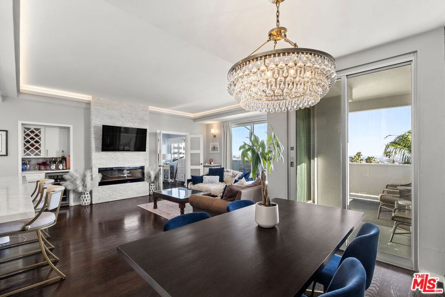 One of the Best View Corner Units at Franklin Towers now available! Move into this incredibly remodeled Stunning home with open floor plan and 180 degree views of LA City, Hollywood and West to Century City and beyond with a wrap around balcony including a Massive Lux Huge Spa Like Rain Shower in Primary, Stack Stone Electric Fireplaces in Primary and Living Room, Custom GE Cafe Kitchen Appliances, Custom Cabinetry,  Hardwood floors throughout Living, Dining and Guest Bedroom, New Fleetwood Sliding Doors and Windows, Built in Murphy Bed in Guest Bedroom/Office/Den, Built in Wet Bar and accessories closet and more! Building amenities include 2 parking spaces across from the elevator, Heated Pool, Spa, Sundeck, Exquisite Roof Top Fitness Room and Sundeck, Valet, 24 hour Door Personnel and more. A Rare Offering Indeed!