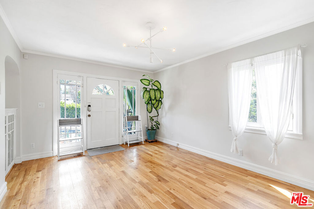 What a showstopper! This single-family home is located on a quaint street in Echo Park, just a short stroll to all of your fave coffee shops, restaurants, and Sunset shops. Some super close spots include Valerie, Canyon Coffee, Cookbook, and Glowing Juices to name a few. Get your daily steps in and reward yourself with an iced latte or green juice while you're at it. You can also go for a hike in Elysian Park, one of the most beautiful walking areas in LA, with stunning views of downtown! Just in time for spring! Back at home, thoughtful decisions have been made throughout the property to keep the original charm but offer updated features. Through the front door, you are immediately greeted by the sunny living room with windows all around. A beautiful built-in sits at one end of the living area and will be the perfect spot to house your favorite knickknacks and decor pieces. The galley kitchen can be accessed through an arched doorway and comes equipped with tile countertops, all stainless steel appliances, upper and lower cabinetry for storage, and a sweet eat-in kitchen nook with built-in bench seating and a table. We could imagine brunches enjoyed here or even a day of working from your laptop if you work from home. The bedroom sits in the back of the property so you can escape at the end of a long day. The bedroom features two closets, a Herman Miller light, and easy access to your bathroom area. Last but not least, don't forget to enjoy the private back patio as Spring approaches! Set up a grill, outdoor dining area, and hammock for the perfect sun-filled weekend. Also, located in the back patio is your private laundry area and a shed for additional storage if needed.