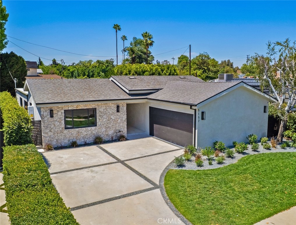 Luxurious reimagined single level home finished with top-tier quality and unique design elements, situated within the coveted Hesby Oaks school district surrounded by multi-million dollar homes. The expansive floor-plan offers 4 bedrooms and 3.5 bathrooms and the home is flooded with tons of natural light. A gourmet Chef's kitchen displaying porcelain countertops and a large center island with breakfast seating flows into the impressive wine display. The luxurious master suite offers a large walk-in closet and spa-like bathroom with double vanity space and walk-in shower. Private yard with ample grassy area, patio dining seating and built-in BBQ area. Additional amenities include surround sound throughout, security cameras, and easy access just minutes from Ventura Blvd and Encino's best schools, shops and restaurants.