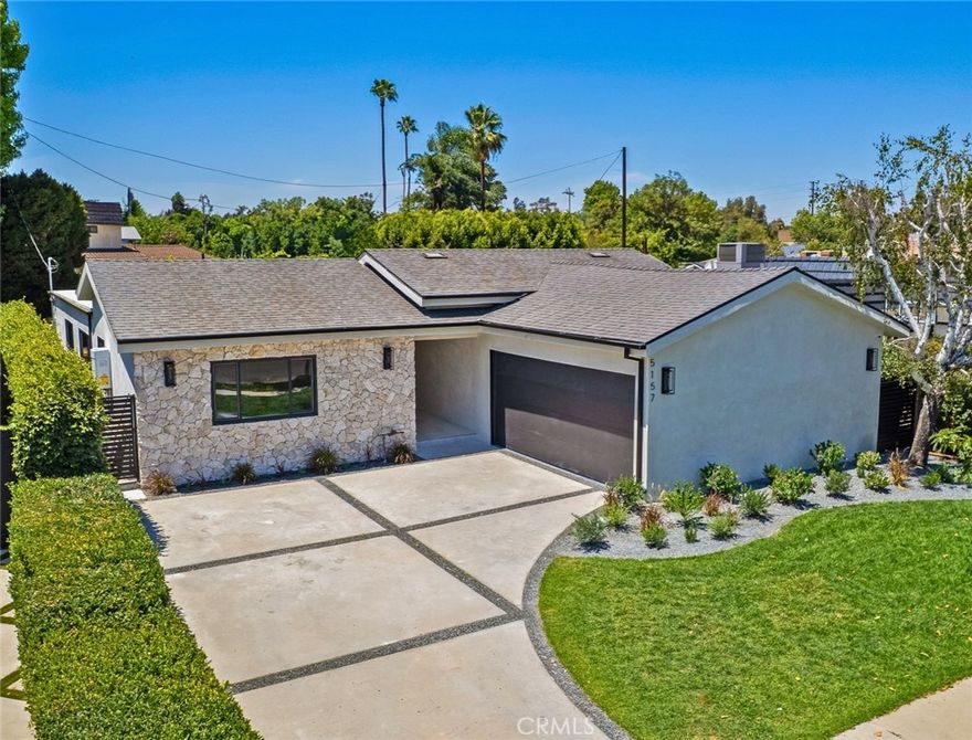 Luxurious reimagined single level home finished with top-tier quality and unique design elements, situated within the coveted Hesby Oaks school district surrounded by multi-million dollar homes. The expansive floor-plan offers 4 bedrooms and 3.5 bathrooms and the home is flooded with tons of natural light. A gourmet Chef's kitchen displaying porcelain countertops and a large center island with breakfast seating flows into the impressive wine display. The luxurious master suite offers a large walk-in closet and spa-like bathroom with double vanity space and walk-in shower. Private yard with ample grassy area, patio dining seating and built-in BBQ area. Additional amenities include surround sound throughout, security cameras, and easy access just minutes from Ventura Blvd and Encino's best schools, shops and restaurants.
