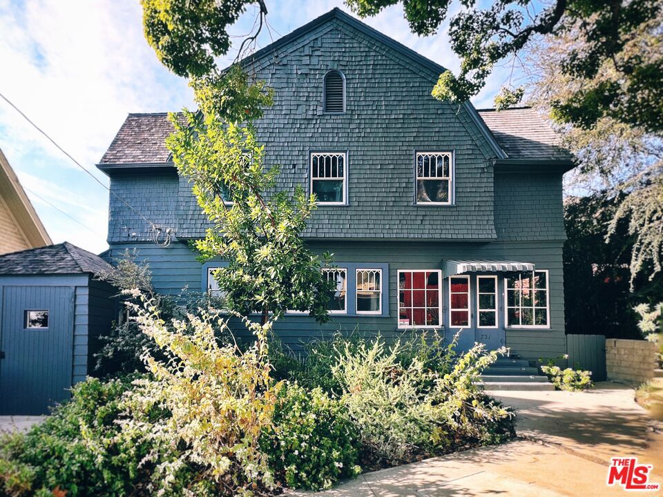 Explore a piece of history in the heart of Echo Park (Angelino Heights) with this stunning Dutch Colonial Revival home, beautifully restored to its former glory. Designed by the esteemed Arthur B. Benton in 1903, this property at 731 East Kensington Road showcases the craftsmanship and elegance of a bygone era in the historic Angelino Heights HPOZ. Step inside this spacious residence boasting 2,363 square feet (appraisal) of living space. The home features four bedrooms and two and a half bathrooms, including a luxurious primary ensuite and a convenient powder room. Architectural details such as pocket doors, quality exposed woodwork, and original light fixtures have been meticulously preserved. Gothic and Craftsman influences are evident throughout, showcasing Benton's signature design skills. Entertain in the expansive living and dining rooms adorned with crown and decorative moldings, or relax in the cozy parlor complete with a decorative fireplace. The chef's kitchen is a culinary delight, fitted with an AGA gas stove, double oven, double refrigerator, freezer, dishwasher all complemented by a double sink and abundant built-ins. The home offers numerous luxury amenities, including a library/den, attic, and partial basement. Enjoy the outdoors on the balcony, deck, or porch, or retreat to the fenced back yard. Modern conveniences abound with central AC and heating, a smart home system with a smart thermostat, a washer/dryer, and elegant fixtures like chandeliers and recessed lighting throughout the home. Appreciate the home's grandeur with its high ceilings, hardwood, tile floors, and a graceful curved staircase. The property boasts both eastern and western exposures, allowing natural light to flood the interiors at all times. A walk-in closet in the primary suite adds to the home's functional elegance.For those seeking a combination of historic charm and modern luxury in one of Los Angeles' most vibrant neighborhoods, this home is an exquisite choice.
