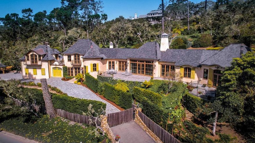 Offering some of the best ocean views possible from every room within and still yet more from the terraces and patios without, Destiny is an ideally situated Pebble Beach estate near the Carmel gate, The Lodge, and the 14th green of the Pebble Beach Golf Links. Designed by Michael Bolton and extensively remodeled by the current owners, this French Normandy Carmel styled home is warm and welcoming with open and spacious living areas with soaring ceilings for entertaining and cozy quiet places and spaces for everyday living. Composed of exquisite materials with incredible attention to detail, this exceptional home offers four cozy fireplaces, a gourmet kitchen, well separated suites with privacy throughout. A never-ending surprise of exciting views of Stillwater Cove where sail boats gently rock in season, crashing waves against Pescadero Pt entertain off-season and green fairways and sunset glows will captivate you no matter what season!. Finished with gleaming wood floors, stone counters, intricate metalwork, stone walls, vaulted beamed ceilings and much more inside and out, this residence will afford you a tremendous enjoyment of living and entertaining delight.