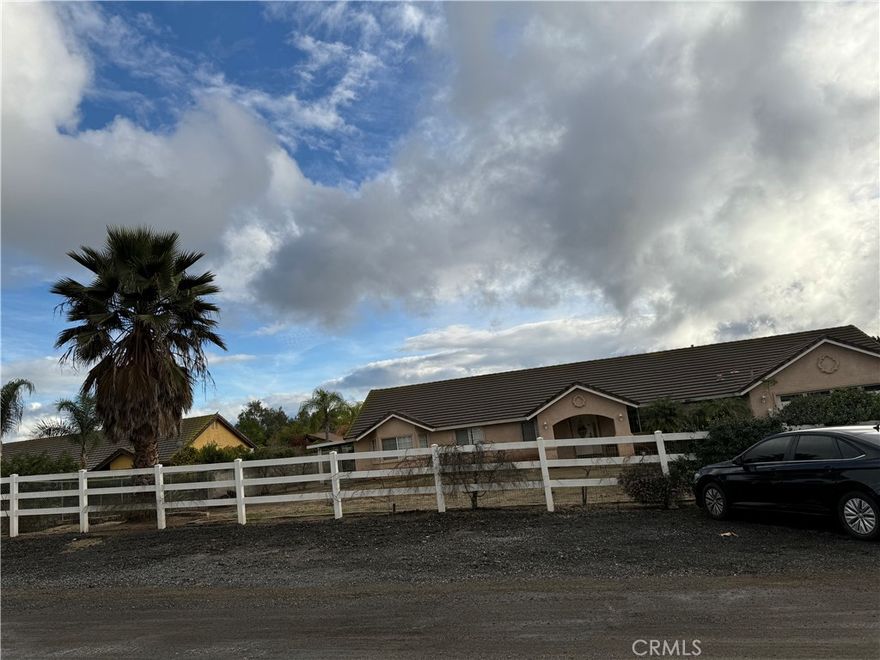 Welcome to this move-in ready spacious single-story home it is situated on a rare 0.83 acre lot of flat land in the appealing neighborhood of Woodcrest, Riverside area. A unique find perfect for income earning or multi-gen since the state allows ADU on the property! The property offers an expansive front porch and ranch-style fencing. This classic 4-bedroom, 3-bath home provides 2,503 sq ft of living space. The impressive lot creates a sense of estate-style living surrounded by pride of ownership, this home delivers a one-of-a-kind combination of space, exclusivity, and convenience with close proximity to top schools, shopping, dining, and major commuter routes. A truly special opportunity to own a private retreat in the heart of Riverside!