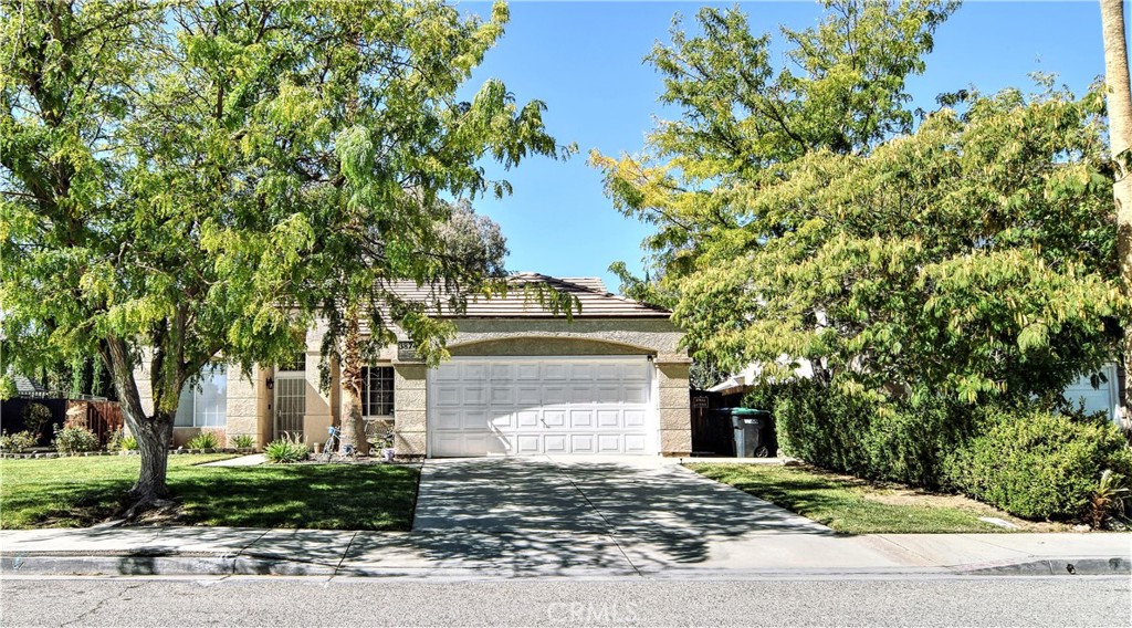 Welcome home to this beautifully maintained single-story gem tucked away on a quiet cul-de-sac in West Palmdale! Featuring 3 bedrooms, 2 baths, and nearly 1,500 sq. ft. of living space, this home offers an inviting open floor plan with vaulted ceilings, a cozy fireplace, and plenty of natural light. The updated kitchen includes modern cabinetry, a breakfast bar, island and a charming bay window perfect for morning coffee. Tile flooring throughout the main living & Dining area and laminate flooring throughout the hallway, bedrooms & laundry room. Enjoy outdoor living under the covered patio overlooking a spacious backyard—ideal for entertaining, relaxing. Conveniently located near Highland High School, shopping, and commuter routes, this property combines comfort, convenience, and curb appeal. Also includes the brand new electric car charging system.
Move-in ready and full of charm — don’t miss this West Palmdale beauty!
