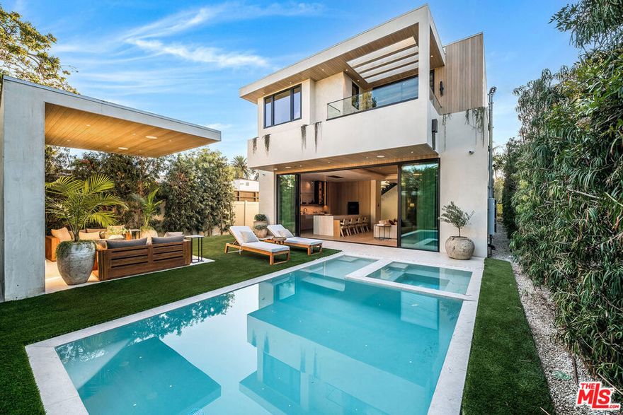 Crafted with exquisite detail, this brand-new construction home brings a breath of fresh air to the luxury modern aesthetic. Meticulously pieced together with the finest imported Italian finishes, Marseilles hardwood floors, and Venetian plaster throughout, this timeless home captures the epitome of design, comfort, and functionality. Centrally located and just minutes from West Hollywood, The Grove, Erewhon, and Whole Foods, 524 Sierra Bonita offers convenience to Los Angeles' premier restaurants, shopping centers, and entertainment. Each bedroom boasts its own private bath, with the primary suite offering two sizable walk-in closets, a private patio, and a deep freestanding bathtub with a rainfall shower. The open-concept floor plan creates an optimal environment for entertaining family and friends, with floor-to-ceiling Fleetwood glass doors that open to a private backyard featuring a stunning cabana, pool, and spa. The kitchen includes high-end Italian cabinetry by DI Group, white Italian stone, and Miele appliances. With natural light bathing the interior's rich, warm, and neutral tones, this home exudes luxury, timelessness, and rare elegance.