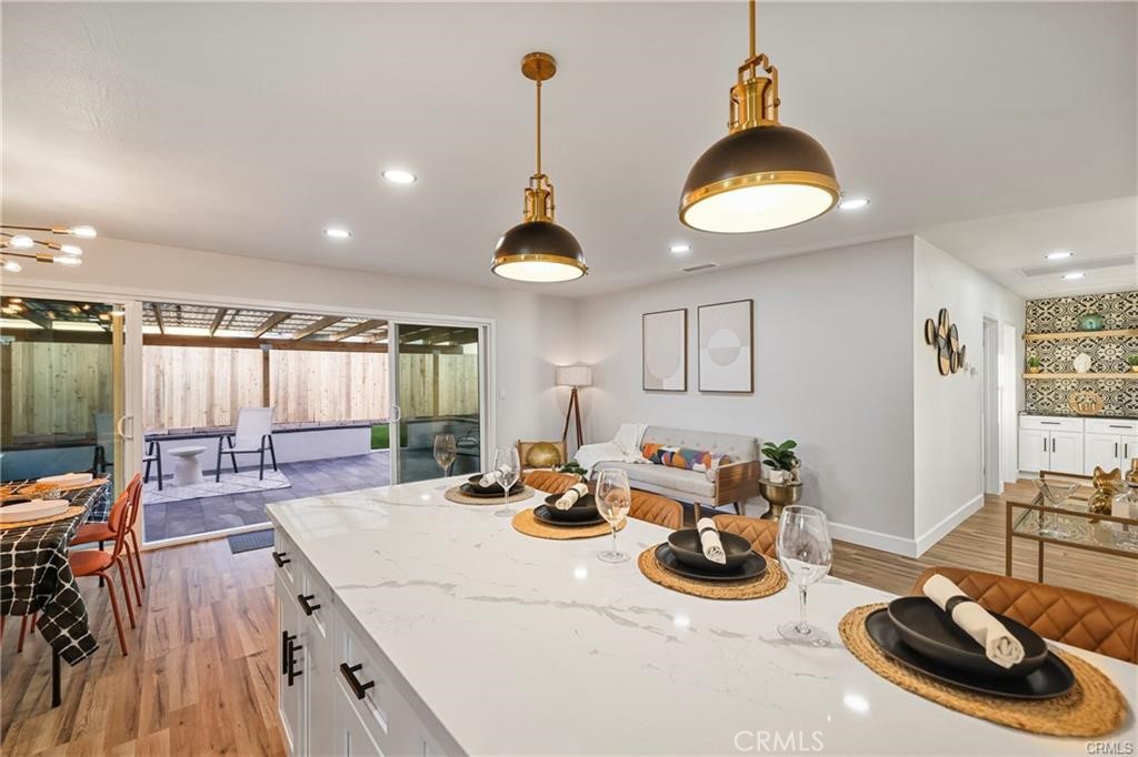 Welcome to 9793 FELIPE AVE, Montclair: Check this beautifully remodeled single story residence! 4 bedrooms and 2 full bathrooms makes it perfect for the growing family needing extra space. You will appreciate the open floor lay-out design and all the of upgrades added. Laminate flooring through-out, ceilings fans, black matte trim recess lighting, closet doors, all modern light fixtures, designer baseboards, remodeled Kitchen with bay, white shaker cabinets with self closing drawers and covers, black matte handles, Quartz counter tops, decorative Spanish tile back splash, floating shelves and stainless steel kitchen appliances. The bathrooms were also upgraded and feature tile flooring, decorative wall tile with inserted soap dispensers, frame-less glass shower doors in black matte, LED mirrors, modern exhaust fans, light fixtures and designer vanities. Every door in this property has been replaced with new ones. Tankless water-heater and so much more! You will love the large driveway with RV Parking and a two car garage (with 2 remote controls) freshly painted and with epoxy floors! The landscaping is drought tolerant for energy efficiency. In the front and back find artificial turf, gravel stones, DG (decomposed granite), succulent plants, decorative hardscape, mulch, a brick fire pit, concrete pathway and a rear covered, blocked, coped & tiled patio perfectly done for entertaining and holiday gatherings. The laundry is conveniently located inside the house and has also been recently upgraded. Property was fumigated in 2023 and had a new wooden fence installed and in excellent conditions for extra privacy.