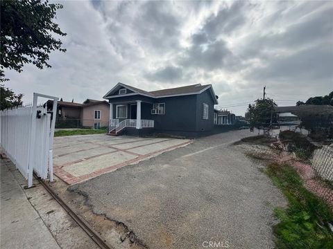 Photo of 1420 E 77th Place, Los Angeles, CA 90001 (MLS # IV26006357)