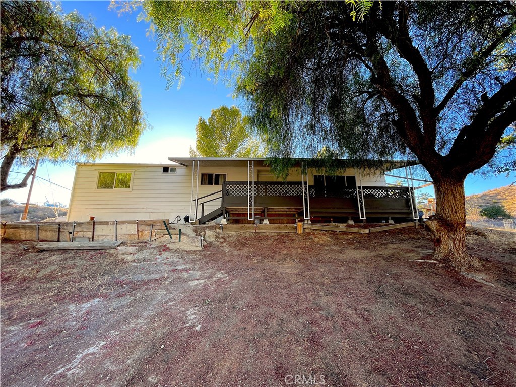 Peaceful country living just 10 minutes east of Temecula! This beautifully maintained manufactured home offers 3 bedrooms, 2 bathrooms, and a versatile bonus/utility room on a fully usable 1.02-acre lot—the perfect blend of comfort, space, and tranquility.
Inside, you’ll find 1,344 sq ft of light-filled living space with thoughtful updates throughout. The interior paint, re-glazed showers, toilets, and HVAC system are all just one year old, while the kitchen has been refreshed with new paint, modern hardware, and updated appliances. The charming built-in china hutch has also been painted and outfitted with new hardware, adding character to the dining area.
The exterior, deck, and trim have all been newly painted, and the property is well-maintained and move-in ready. Additional features include a shared well with a 1-year-old pump, an 865-gallon water tank, a water booster, a storage shed, and full fencing with a sliding gate at the entrance.
With scenic views of Palomar Mountain, no HOA, and plenty of space for horses, livestock, or gardening, this home offers the best of rural living while keeping you close to all the amenities of Temecula.