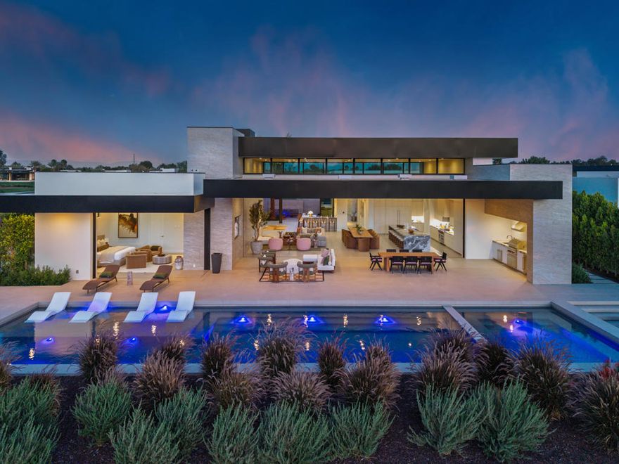 Indulge in unparalleled luxury with this stunning custom single-level home at the prestigious Madison Club. Boasting five spacious bedrooms and five and a half bathrooms across an expansive 6,476 square feet, this residence offers the perfect blend of comfort and elegance. The open-concept design features a gourmet kitchen and a stylish bar, all while showcasing breathtaking views of the Santa Rosa Mountains. This beautifully crafted home is ideal for those who cherish refined living, situated conveniently next to the 11th tee of the renowned Tom Fazio-designed golf course. Don't miss your chance to claim this exceptional property!