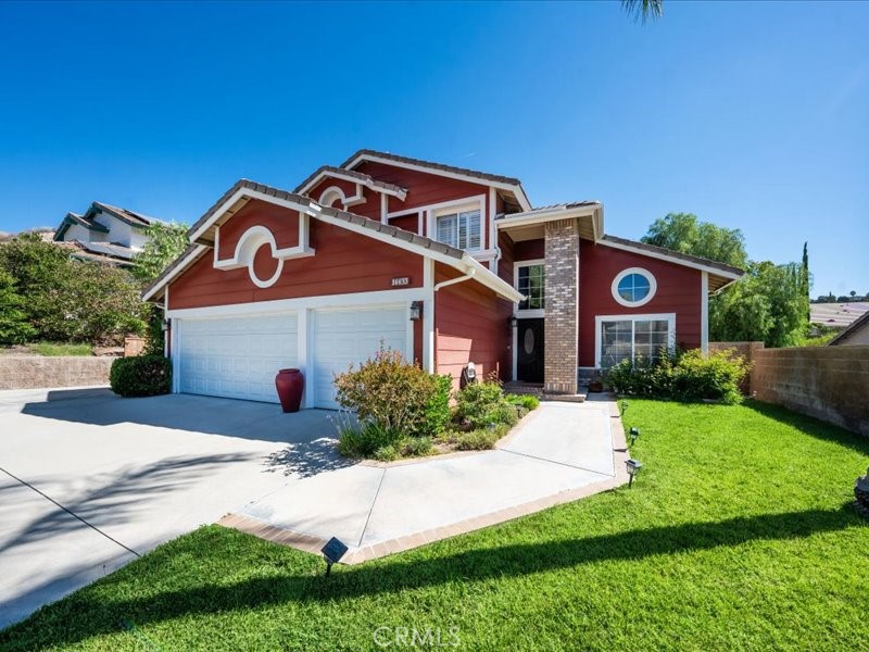 Welcome to this beautifully upgraded 4-bedroom, 2.75-bath home nestled in the heart of the Stonecrest community of Canyon Country. From the moment you enter, you're greeted by a sweeping spiral staircase and a light-filled open floor plan—perfect for entertaining and family living.
The spacious kitchen is a chef’s dream, showcasing recessed LED lighting, expanded cabinetry, granite countertops, and premium stainless steel appliances—including a KitchenAid double oven, a 36-inch 5-burner gas cooktop with vented hood, and an LG double-door refrigerator. Recent upgrades feature a large center island with custom cabinets, soft-close doors and drawers, a pull-out stand mixer shelf.
The downstairs offers durable tile flooring throughout, providing both style and easy maintenance—ideal for everyday living—while the formal dining and living rooms are finished with rich hardwood, adding warmth and elegance to these inviting entertaining spaces. This level also includes a bedroom with a 3/4 bath, perfect for guests or multi-generational living, complete with custom built-in closets and updated flooring plus an indoor laundry room with storage cabinets, a large sink, and direct garage access.
Upstairs, the spacious primary suite includes a retreat area, a walk-in closet with custom built-ins, and a spa-like bathroom with dual sinks, a vanity area, soaking tub, and walk-in shower. Two additional bedrooms are connected by a Jack & Jill bathroom and feature custom closet built-ins.
In addition to the direct-access 3-car garage, there is room for 4 cars in the driveway as well as a gated RV or utility trailer parking area. The garage features brand-new doors and extensive built-in, floor-to-ceiling cabinets with adjustable shelving, offering versatile and abundant storage for all your needs.
The Leased SunRun Solar Panels help minimize electricity costs all year round, especially in the summer months.
Enjoy nearby parks just minutes away for recreation and family fun.
This move-in ready home offers luxury, functionality, and convenience—all in a quiet, family-friendly neighborhood.
Schedule your private tour today.
