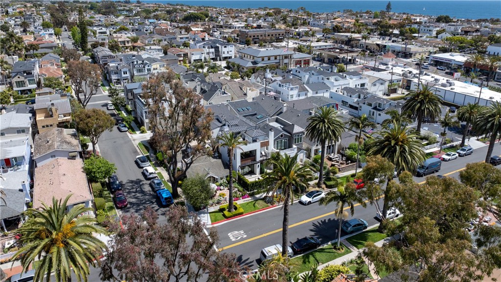 Just moments away from world-class shops, renowned restaurants and the breathtaking beaches of Corona Del Mar, this newly built soft contemporary residence offers the ultimate in coastal living. Ideally positioned in one of the most accessible locations in all of CDM, this property is a rare gem.
This exceptional four bedroom, four-bathroom home features a unique first-floor bedroom/office and bathroom—a rare find in the village. The open-concept chef’s kitchen, outfitted with top-of-the-line Dacor appliances, flows seamlessly into the expansive great room. La Cantina sliding doors blur the lines between indoor and outdoor living, opening to multiple private lounge areas—each complete with a fireplace—ideal for year-round al fresco dining and entertaining.
Curated with Restoration Hardware furnishings and sophisticated finishes throughout, the home also boasts porcelain tile and wide-plank oak flooring, Jeld-Wen windows, Bluetooth surround sound and a state-of-the-art Lutron smart home system.
All three bedrooms feature en suite bathrooms and generous closet space with custom built-ins. The luxurious primary suite includes a spacious walk-in closet, a freestanding soaking tub and a walk-in shower. One additional bedroom and bathroom are located on the second level, while the third bedroom sits atop the home with access to the rooftop deck—great for entertaining while taking in village views.
With unmatched access to the best of Corona Del Mar, this home blends modern elegance with a premier location—making it a truly exceptional offering.