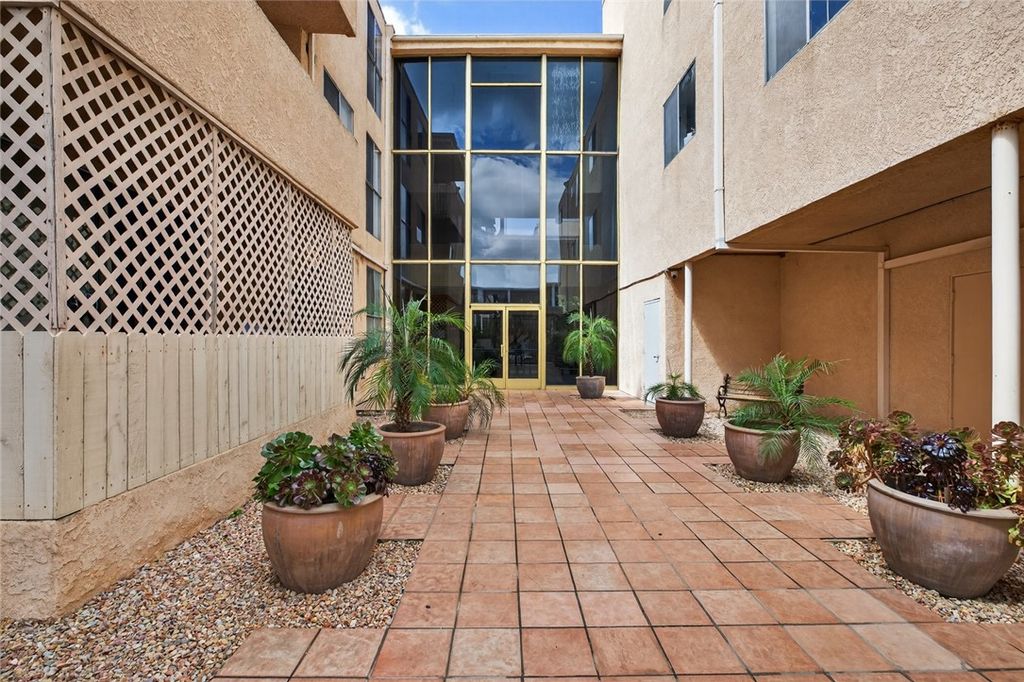 Photo of 5429 Newcastle Ave #204, Encino, CA 91316 (MLS # SR26071039)