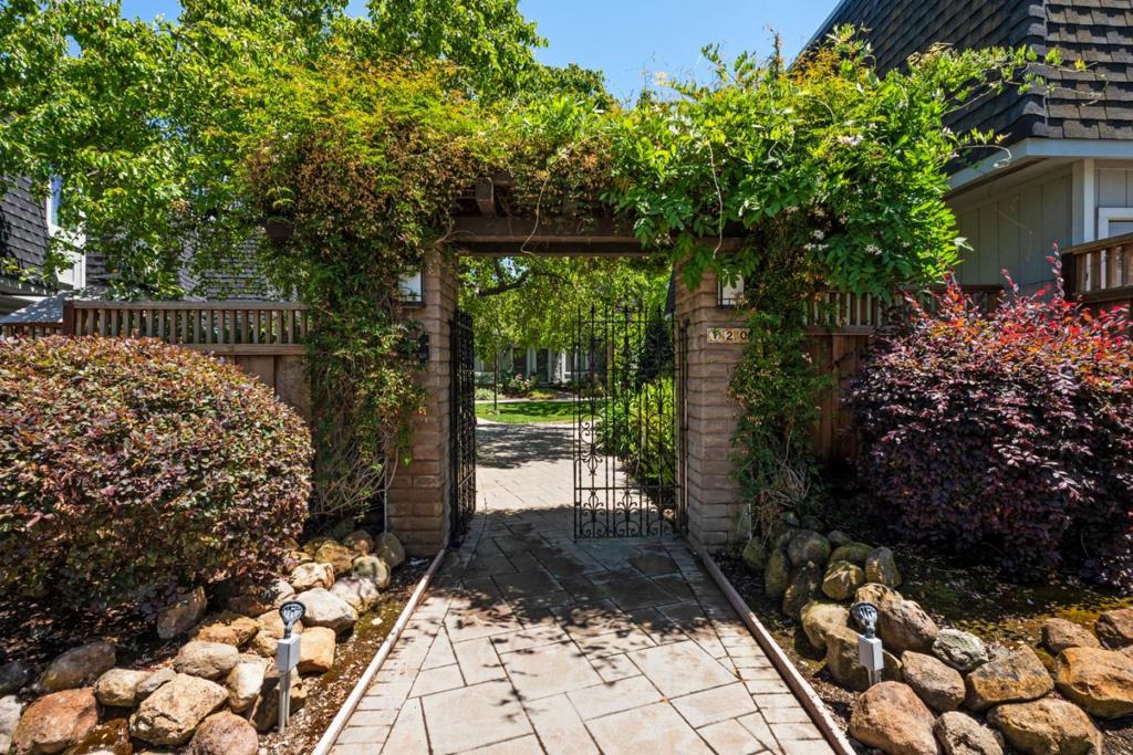 Welcome to your private oasis in the heart of Los Gatos, move-in ready with top-rated schools. Tucked behind a charming iron gate, this beautifully updated 2-bedroom, 1.5-bath end-unit townhome offers rare privacy and peaceful living flooded with natural light. Expansive windows throughout and two bright skylights create an airy feel, with only one shared wall adding to the sense of privacy. Step inside to premium flooring, brand-new carpet in the bedrooms, fresh interior paint, stylish lighting, a fully renovated bathroom with skylight, and a new kitchen with quartz countertops and modern cabinetry and appliances, all thoughtfully finished with comfort and style in mind. Enjoy your own private patio, plus access to a lush, well-kept intimate community with a sparkling pool and serene walking paths. All of this, just minutes from the Los Gatos mountains, morning walks to Philz, Whole Foods, and top-rated schools. Homes like this dont stay quiet for long. Come see it before its gone!