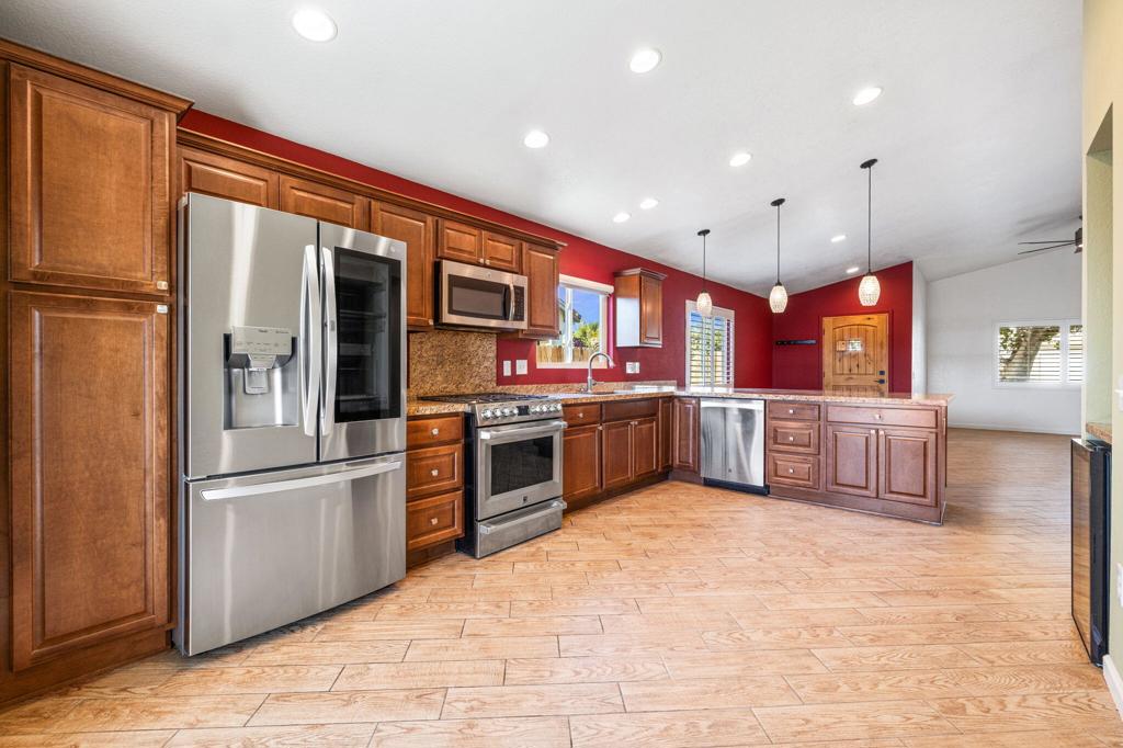 Welcome to one of the finest homes in the gated community of Sunny Side Estates! Recently refreshed with a beautifully painted interior, this rare gem is move-in ready and brimming with high-end upgrades. Originally remodeled in 2014, the home has been thoughtfully improved over the years, including all-new windows and slider (2019), a completely finished garage (2021) with insulated garage door and new opener, and modern LG washer/dryer and refrigerator.Inside, you'll find plantation shutters throughout, custom closets, recessed lighting, soaring 9-foot ceilings, and elegant wood plank tile floors complemented by upgraded carpet in the bedrooms. The kitchen shines with granite slab countertops, a wine cooler, and quality finishes.The backyard has been landscaped and features a concrete walkway and wooden fence, with no neighbor behind--offering exceptional privacy and a peaceful setting to enjoy the desert lifestyle. All this is located in a secure gated community with a low HOA of just $205/month and the benefit of IID's lower electric rates.This home is a rare opportunity and won't last long--schedule your showing today!