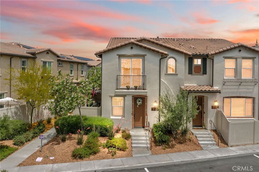 Welcome to this exceptional home in the gated community of Rancho Soleo in South Temecula, offering the perfect blend of style, comfort, and convenience. Located minutes from Temecula Wine Country, Pechanga Resort, and Old Town, and within the top-rated Great Oak High School boundary, this home checks every box. Step inside to a warm and inviting great room featuring wood flooring, crown molding, a ceiling fan, and a custom media cabinet with shelving. The open-concept kitchen is a showstopper—featuring quartz countertops, upgraded designer cabinetry, a large pantry, and a generous island with bar seating. Additional upgrades include glass-front cabinets with built-in lighting, a stainless-steel farmhouse sink, new refrigerator and dishwasher, built-in microwave and stove, under-cabinet tile and lighting, and an instant hot water system. Recessed and upgraded lighting throughout the kitchen, dining, family room, and bedrooms adds both function and style. Upstairs, the luxurious primary suite features two grasscloth accent walls, a large walk-in closet, and a spa-inspired bathroom with oversized tile flooring, dual sinks, a fully tiled walk-in shower, and a dramatic mirror wall. Two additional bedrooms offer wood flooring, ceiling fans, upgraded lighting, and generous space—one with a walk-in closet. The upstairs laundry room offers built-in cabinetry and comes complete with a washer and dryer. A nearby guest bathroom has been upgraded with designer tile flooring and a stylish accent wall. Additional features include plush carpeting installed in 2024, upgraded baseboards, a soft water system, and a finished garage with epoxy flooring and built-in storage cabinets. A grasscloth accent wall in the main living area adds warmth and texture. This is also a smart home, offering modern convenience and enhanced energy efficiency. Outside, enjoy a private fenced patio that’s ideal for entertaining. It features a professionally installed bar with an arbor overhead, built-in seating, and fun tiki décor. The side yard is larger than most in the community and is enclosed by a tall privacy fence—perfect for pets, kids, or relaxing in peace. Rancho Soleo offers resort-style amenities including a sparkling pool, spa, and several playgrounds, all within a beautifully maintained and gated community. With paid solar, designer finishes, and a sought-after location, this home offers style, efficiency, and comfort. Don’t miss the opportunity to make it yours!