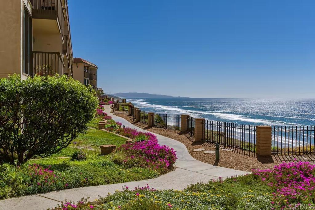 Welcome to this charming fully furnished 2BD/2BA OCEAN VIEW home nestled on the spectacular bluffs of Solana Beach in the gated community of Del Mar Shores Terrace. Step inside this second floor END UNIT to discover a thoughtfully designed 1,135-square-foot haven with an open-concept living space. The kitchen features granite countertops and breakfast bar complete with a stainless steel refrigerator and microwave. The living room with a cozy fireplace leads to one of three balconies with ocean views. Additional highlights include tile/wood style flooring throughout, ceiling fans, remodeled baths, stackable washer/dryer and one dedicated space in the parking garage. Del Mar Shores Terrace offers ocean front panoramic views from the community pool/spa and newly renovated clubhouse not to mention DIRECT beach access with stairs to the sand. Award winning school district! AMAZING location within walking distance to the Amtrak Train Station, Dog Beach, Fletcher Cove and the Cedros Design District with boutique shopping, upscale dining, outdoor cafes and trendy art galleries. Don't miss this opportunity to enjoy resort style living at the beach year around. Available NOW for a one year lease!