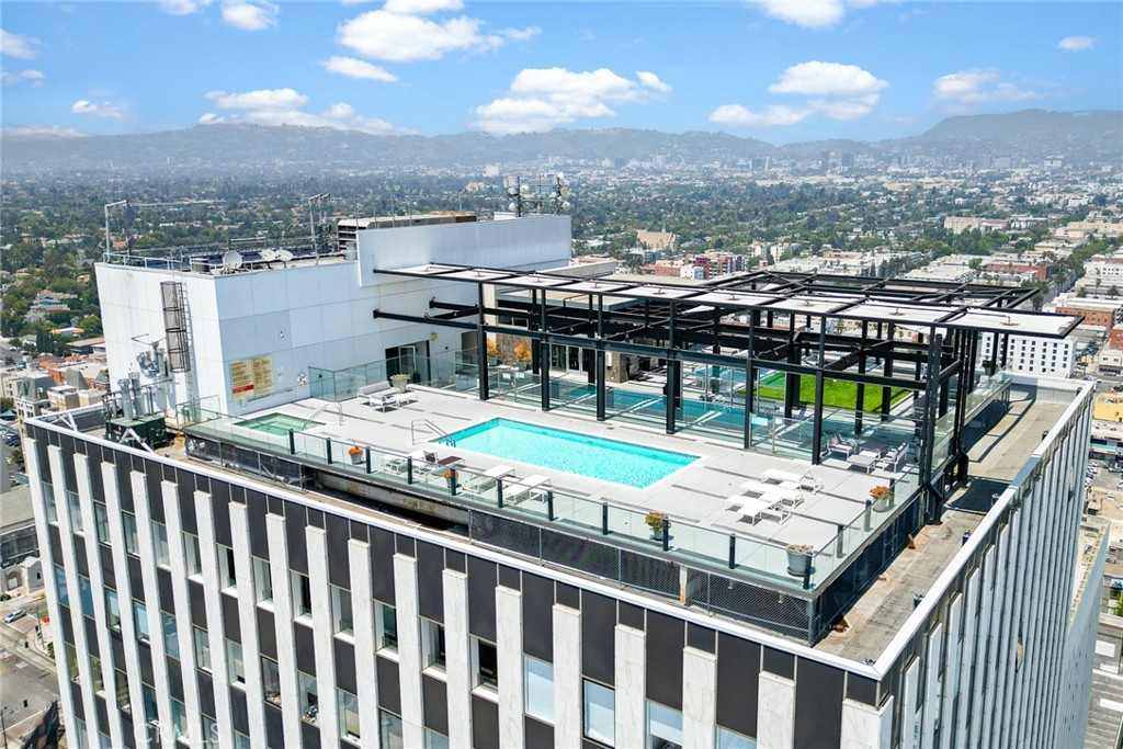 Wake up to the iconic Hollywood sign and sweeping city skyline views — all from your own 1 bed, 1 bath condo with 830 sq ft of stylish living space. Perched on a high floor in the vibrant heart of Koreatown, this residence offers panoramic, unobstructed vistas that capture the very best of Los Angeles living. Unit comes with its own parking and electric vehicle charging along with a separate storage space. Step outside and enjoy upscale amenities such as a rooftop pool and spa, a fire pit with cozy seating, a barbecue area designed for entertaining, an expansive event lawn, and a fully equipped fitness center — all with 24-hour building security for peace of mind. Just steps away you’ll find H Mart, Children’s Hospital, 24 Hour Fitness, Liberty Park, and an endless array of award-winning restaurants, cafés, and nightlife. With quick access to DTLA, Hollywood, and Beverly Hills, this condo delivers the perfect balance of luxury, convenience, and lifestyle. Don’t let this exceptional Koreatown home slip away — make it yours today!