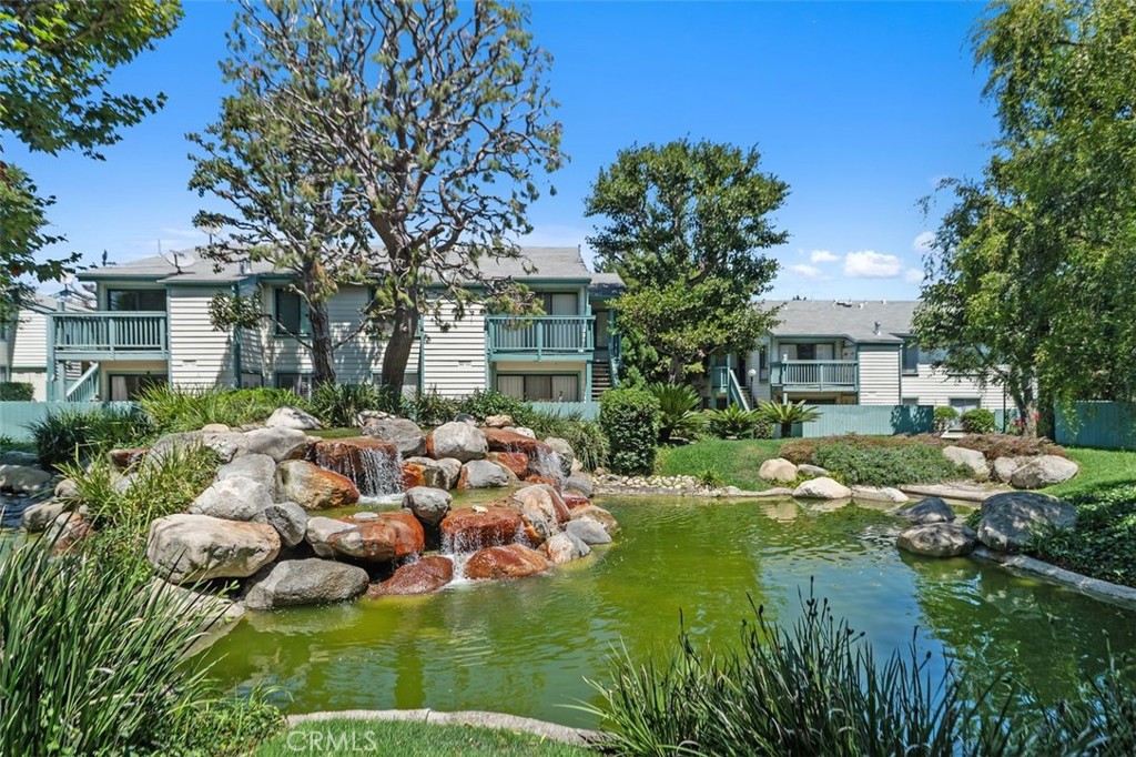 Welcome to the beautiful Ponderosa West gated community! This corner unit is in a peaceful and serene location with an updated kitchen, 2-bedrooms, 2-newly remodeled bathrooms with laundry inside the home. This light-filled home features high ceilings in the living room, creating a spacious and airy feel. The living room opens to a private balcony with a relaxing atmosphere perfect for enjoying your morning coffee or winding down in the evening. Vinyl flooring is installed throughout the unit, with recessed lighting featured in select areas, offering a modern, low-maintenance lifestyle. The primary suite is generously sized and features an en-suite bathroom and a good-sized walk-in closet, providing both comfort and functionality. The second bedroom also offers ample space, making it ideal for guests, an office, or a flexible work-from-home setup. This unit includes two reserved parking spaces and the community offers abundant guest parking throughout. This well-maintained complex features 2 swimming pools, 2 spas, and 3 peaceful streams surrounded by lush greenery, providing a relaxing environment for residents. The pet-friendly setting offers paths throughout the neighborhood for daily strolls and outdoor enjoyment. Whether you're looking for a tranquil retreat or a stylish space to call home, this condo has it all.