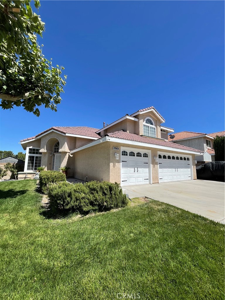 Welcome to this beautifully maintained two-story home situated on a quiet cul-de-sac in West Lancaster. At approximately 2,520 square feet of living space, this residence features 4 bedrooms and 3 full bathrooms, including a desirable downstairs bedroom and bath—ideal for guests or multi-generational living. The main level boasts vaulted ceilings, an inviting living room, and a spacious remodeled kitchen with ample cabinetry, granite countertops, and a center island for added prep space and seating. Upstairs, the primary suite includes a private balcony, dual sinks, a soaking tub, separate shower, and generous closet space. Two additional bedrooms share a convenient Jack-and-Jill bathroom. Enjoy outdoor living in the landscaped backyard with a covered patio, sparkling pool and spa, and room to entertain. The corner lot provides added privacy, a 3-car garage, and potential RV access. Located near local schools, parks, shopping, and commuter routes, this home blends space, comfort, and location in one of Lancaster’s most sought-after neighborhoods.