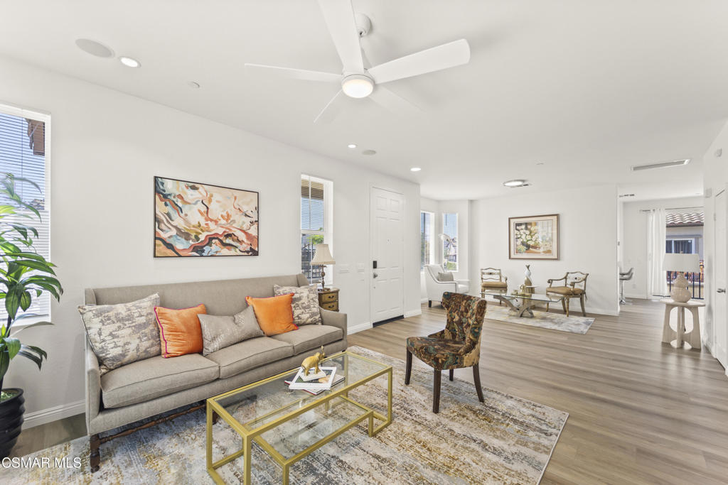 One of the largest floor plans in the community, this highly desirable end unit boasts abundant windows, natural light, and a fresh, modern feel. Recently renovated with beautiful new flooring and top-tier kitchens and bathrooms, this Dos Vientos townhome offers a rare blend of style, comfort, and location.Set in a quiet, private Aldea location surrounded by scenic hills and the Santa Monica Mountains, you'll enjoy year-round outdoor living with nearby hiking, biking, and parks. The bright, open layout includes an upgraded kitchen with quartz counters, stainless steel appliances, a large center island, and under-cabinet lighting. The inviting living room features a gas fireplace and built-in speakers.Upstairs, spacious bedrooms await--including a sun-filled primary suite with a walk-in closet and spa-like en-suite bath. The direct-access 3-car garage offers generous storage, and the community provides two pools/spas with spectacular views. Walk to award-winning Sycamore Canyon School, local parks, and sports courts--perfect for those who love nature and an active lifestyle.
