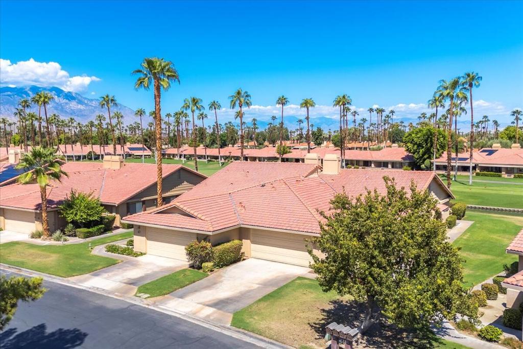 It's all about the location! End unit on a quiet cul-de-sac, with a oversized rear patio right on the 12th hole, with adjacent pond & fountain, endless greenbelts, and incredible mountain views! After all, Chaparral County Club is known for its par-3/60 award winning golf course -yes, but there is so much more! From the wonderful clubhouse with full dining & bar facilities, to the expansive fitness center or gaming rooms, and even a onsite pro shop. Get your golf, tennis, pickle ball dialed in, or maybe just enjoy all the pool/spa relaxation, or card playing, billiards, or other social activities ...pretty much everything is right here! Now back to the lovely home, this unit was recently renovated to include stainless appliances, white quartz countertops, and gray woodgrain flooring throughout. Enjoy the bright white expanses of the great room with ~20foot cathedral ceiling, and the fireplace too ...or maybe down the hallway to the bedrooms and baths, all bright & colorful, with solar tube lighting and other colorful accents, plus modern ceiling fans and bahama shutters. The primary bedroom/bath also boosts features like the remodeled dual-vanities, plus separate tub & shower. Laundry area inside, and then out to the large 2-car attached garage with epoxy flooring, and lots of storage as well. COME SEE US TODAY!! Oh, and did we mention that the HOA also includes cable TV! Base HOA $750 plus $412 social HOA. Lots of goodies here, and many things included :) -see Chaparral CC for details.