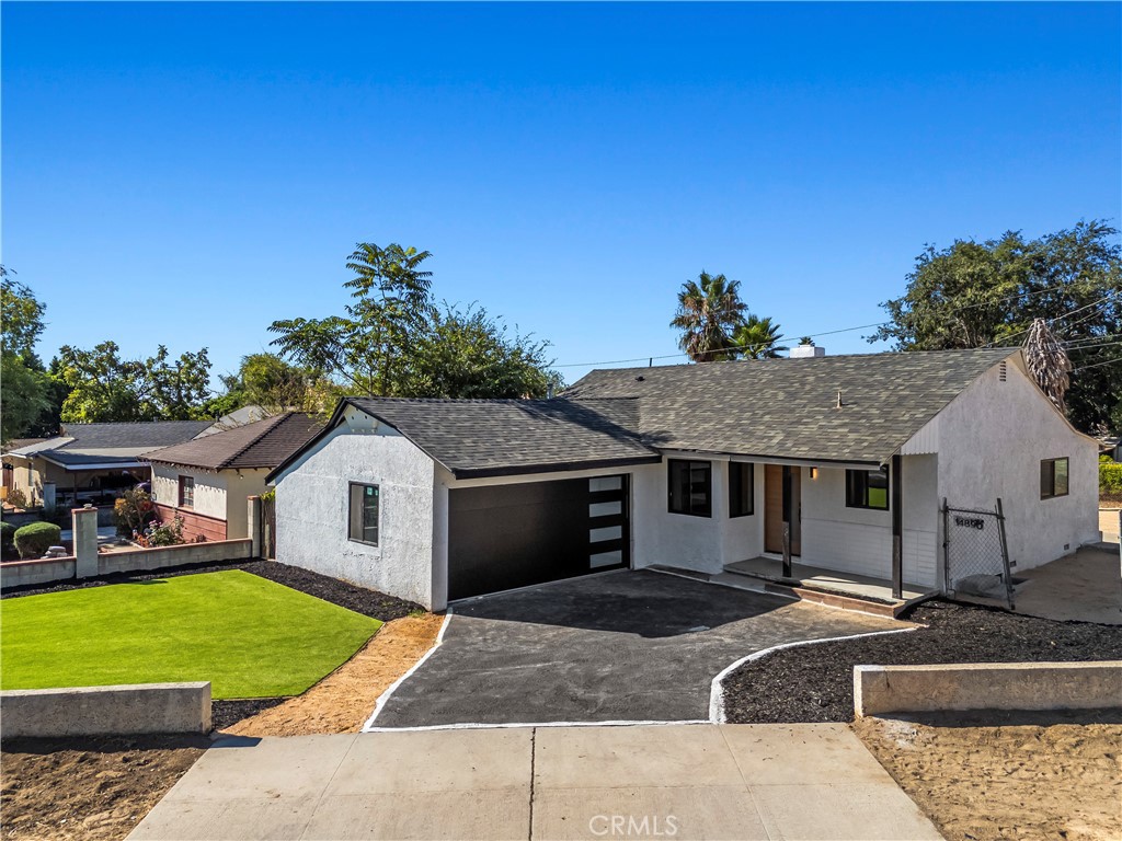 Stylishly updated, this 3-bedroom, 2-bathroom home offers 1,198 sq ft of living space on a gated 5,798 sq ft lot that feels much larger. The open kitchen showcases custom white oak cabinetry, quartz counters, LED under-cabinet lighting, and a central island crowned by a designer chandelier-the true heart of the home. Baths are beautifully remodeled, including one with a floating quartz sink. Major upgrades include new roof, windows, HVAC, plumbing, electrical, and more. A spacious yard with ADU potential completes this turnkey residence.
