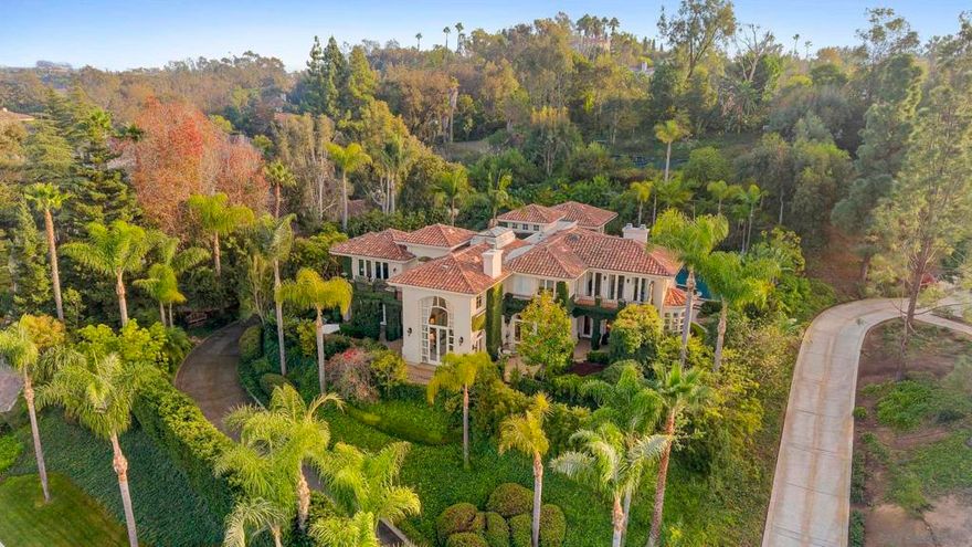 Revel in peace and serenity at Villa Calle Serena! Lovely treetop views and a private backyard oasis with lush gardens, expansive paver patios and an inviting Pebble finish pool and spa can be yours to enjoy, every day! Inside, you'll love the remodeled kitchen by Jackson Design and Remodeling, featuring custom furniture-grade cabinetry and high-end Wolf and SubZero appliances. The kitchen is open to an inviting breakfast nook and spacious family room, filled with natural light. Entertain friends or family in the formal living and dining rooms, with multiple sets of French doors bringing the outdoors in. Two bedrooms with ensuite baths complete the main level. The luxurious primary suite and three additional bedrooms are upstairs, each with ensuite bath and private balcony with stunning views — including a peek at the south side lake!  You'll love the Fairbanks Ranch lifestyle! Residents enjoy top-notch security with manned gates and 24-hour roving patrols, 75-acres of common area with walking trails and equestrian trails, a private lake with fishing and paddle boating, four tennis courts, four pickleball courts, clubhouse, private park with play equipment for children, sand volleyball and half basketball court, and a first class equestrian center with three riding rings. Residents also enjoy access to excellent public schools including Solana Santa Fe School (K-6), Earl Warren Middle School (7-8) and a choice of Torrey Pines High School or Canyon Crest Academy.