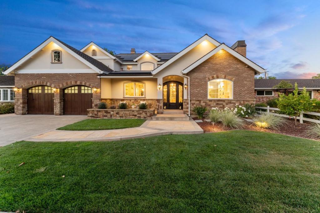 This masterfully crafted custom home blends timeless design with luxurious finishes in one of Willow Glen's most coveted neighborhoods. Designed by architect Lou Costanzo and built by Sunzeri Construction, every inch of this residence reflects meticulous attention to detail. Absolutely gorgeous entry with a dramatic seven-foot wide brick barrel ceiling. The chef's kitchen is a showstopper featuring a LaCornue commercial range, Sub-Zero fridge and freezer, oversized island with prep sink, pot filler, curved wood cabinetry, and a 36-inch convection oven. Hand-scraped Amish hickory floors, signed on the back, extend through spacious living areas with soaring 11-foot ceilings, eight-foot arched solid wood doors, and stunning custom cabinetry throughout. Enjoy a dual primary suite layout, with one expansive suite on each level. Entertain effortlessly in the grand great room with a stunning floor-to-ceiling fireplace, built-ins, and 80-inch TV, or exit outside to a built-in outdoor kitchen with BBQ, stove, warming drawer, and fridge. Enjoy two luxurious primary suites, two gas fireplaces, and a four-car garage with epoxy floors. This is a ONE-OF-A-KIND property that offers elegance, comfort, and craftsmanship rarely seen. It is more than a home, it is a legacy property.