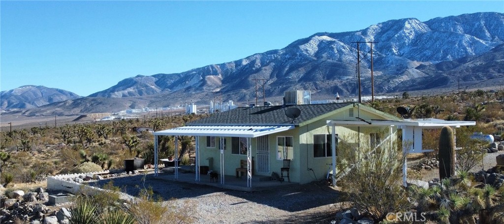Cozy cottage style 2Bd 1Ba home sits high above the Lucerne Valley, with extra large detached garage that has plenty of room to have your shop/craft room. The home has had some recent updates, and offers an open floor plan to the living room and comfortable kitchen. Covered porch with spectacular views of all Lucerne Valley And San Bernardino mountains. Plus there are 4.2 Acres of land with two sheds to explore and let your imagination run wild and entertain guests with outdoor activities. This lot is serviced with haul water pressure system for all your domestic water needs. Just a short drive to Big Bear and mountain resorts. Lucerne town center 10 minute drive for all shopping, food, postal and hardware needs. This home comes Furnished!!!