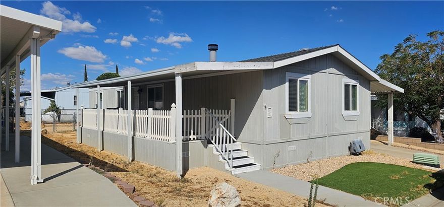 Here is your opportunity to own a home in Rancho Vista. A West Palmdale gated community. This manufactured home features 3 bedrooms and 2 full baths.  A nice Living Room with fireplace and vaulted ceilings. The kitchen has a nice cream colored cabinets, glass cabinets & granite countertops.  A dishwasher, stove and microwave. Access through the indoor laundry & LR. The master bedroom features a mirrored wardrobe and is located adjacent to the other 2 rooms. Dining room located right off the kitchen. Decorative glass partitions. 2 awnings outside. One with concrete from the back of the property to the front to park a couple cars. A tuff shed painted to match the exterior of the home. A large covered patio is featured on the west side of the home. The property is landscaped with decorative rock, artificial grass and DG. There is a chain linked fence area in the backyard. The park offers a pool, recreation room/ Clubhouse & Security guard at the entrance.