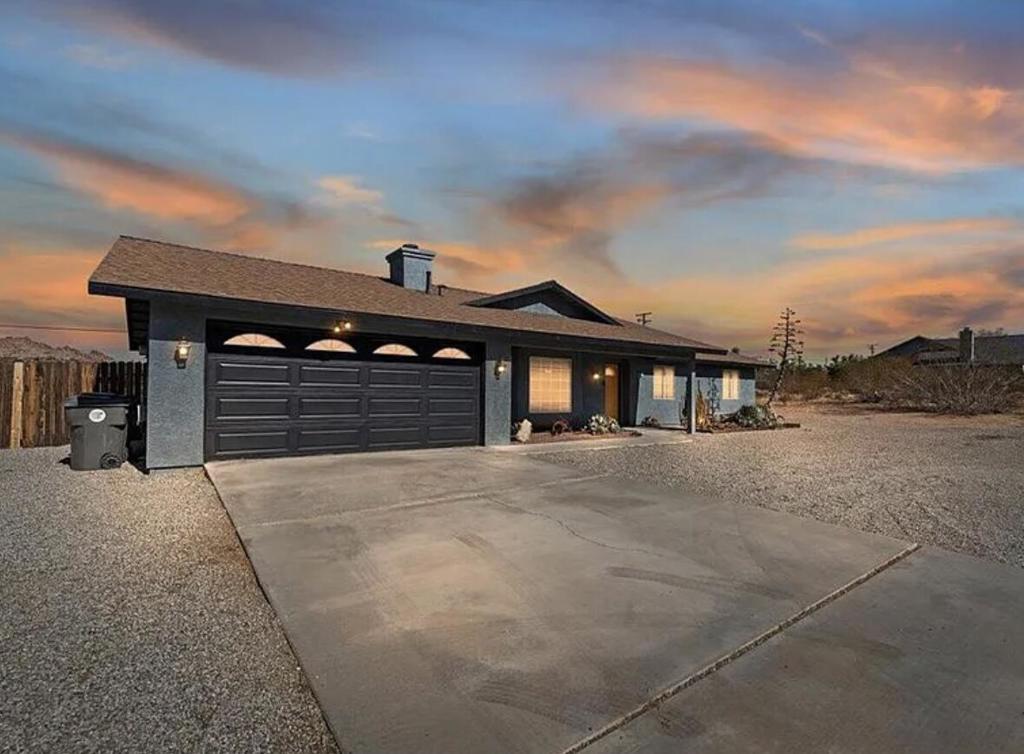 Discover your desert retreat, just 1 mile from the West Gate Entrance to Joshua Tree National Park! This charming, fully furnished 3-bedroom, 2-bathroom home offers 1,323 sq. ft. of beautifully updated living space, where modern amenities blend seamlessly with the natural beauty surrounding this prime location. Step inside to find polished concrete floors, stylish counters and backsplash, stainless steel appliances, and updated paint inside & outside, giving a clean and contemporary feel. Updated ceiling fans and lighting fixtures add a chic touch. Painted interior and exterior, retextured ceilings adds that fresh feel. Dual sliding doors exit you to the backyard, and with the right touches, it can be made into your own incredible oasis. Absorb the breathtaking mountain & desert views on your decking built for an above ground pool. Entertain friends and family at the barbecue island area, perfectly set up for evenings under the desert stars. Whether you're seeking a weekend getaway, a vacation rental, or you're forever home, this property is an incredible opportunity near one of California's most iconic parks. The home can be sold furnished at right price. Ask about keeping the low interest rate by keeping current mortgage in place with creative financing ''subject to'', 760-401-5309.