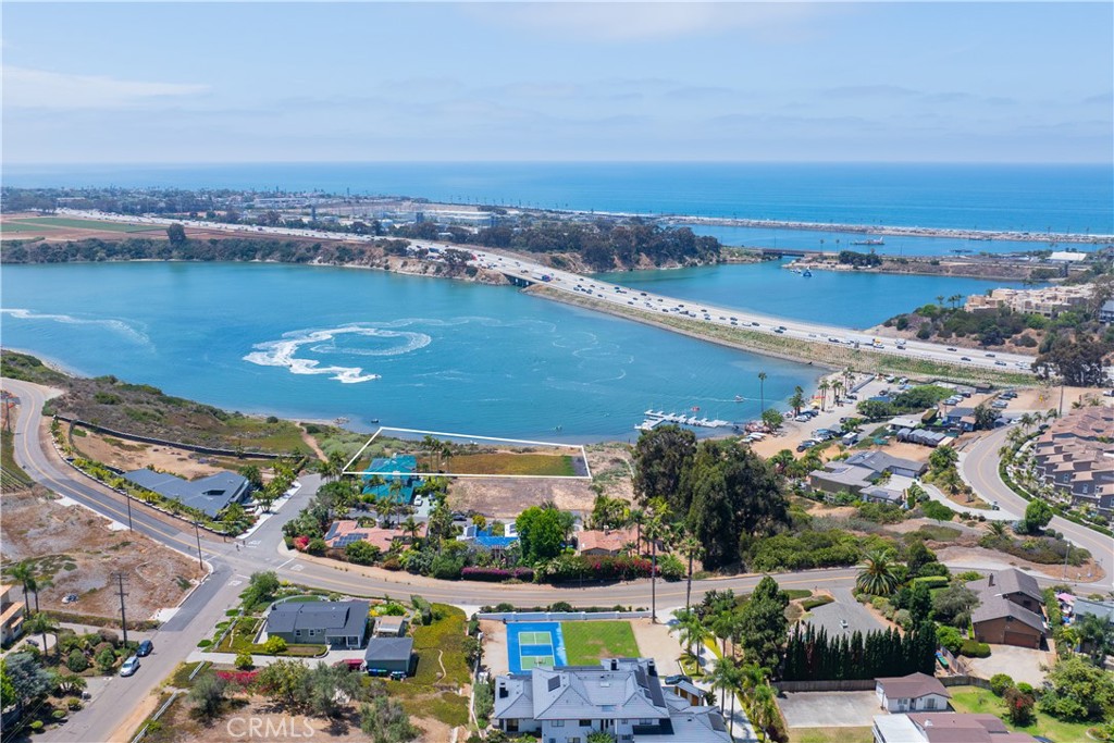 A rare opportunity to own waterfront land on the peaceful shores of the Agua Hedionda Lagoon in Carlsbad, CA. This premium parcel—APN #206-171-03-00—is zoned R-1, offering the ideal setting to design and build your dream single-family home or an upscale development with stunning water views and direct lagoon access.