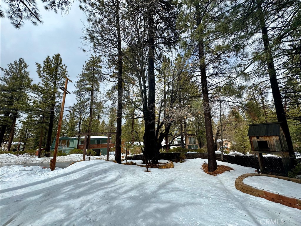The opportunity of a lifetime awaits with this ideal plot nestled within the flourishing community of Big Bear Lake. 41763 Switzerland Dr extends across an expansive 8400 square feet in the esteemed zip code of 92315, offering untapped potential and a unique allure for developers.
Zoned as R-3, Multi-Family Residential, this land fosters an environment of boundless opportunities. The zoning designation invites developers to execute their blueprints and establish exceptional residences or high-end vacation rentals. Each residential unit requires just 7200 square feet, permitting room for creativity and innovation in design. Imagine a ski enthusiast's home or a vacation rental opportunity designed for snow-sport lovers- endeavors made even more promising with the plot's prime location abutting the famed Snow Summit.
Remove the now-redundant wooden play structures; the real charm of this lot lies in its pure, untouched land. The tranquil landscape extends an incredible bonus by bordering Snow Summit renowned for its winter offerings. Future residents or vacationers will relish the convenience of having premier skiing and snowboarding options right in their backyard.
The thriving Big Bear Lake neighborhood, known for its fine dining, charming local shops, and reputable schools, adds further appeal to the property. Its robust real estate market makes the area an ideal location for developing a remarkable residence or an attractive vacation rental.
41763 Switzerland Dr is not just a parcel of land; it's a treasured opportunity. It holds the potential for creating a distinctive dwelling that encapsulates the vibrancy and allure of the Big Bear Lake lifestyle and attractions.