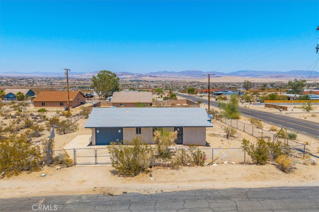Spacious 1 bed, 1 bath cutie, just minutes from Joshua Tree National Park. New flooring and paint throughout, on a huge, fully fenced, corner lot. With all the local shops, and dining, this home offers the perfect blend of tranquility and accessibility. Whether you're a nature enthusiast, military personnel stationed nearby, or simply seeking a peaceful place to call home—this gem checks all the boxes.